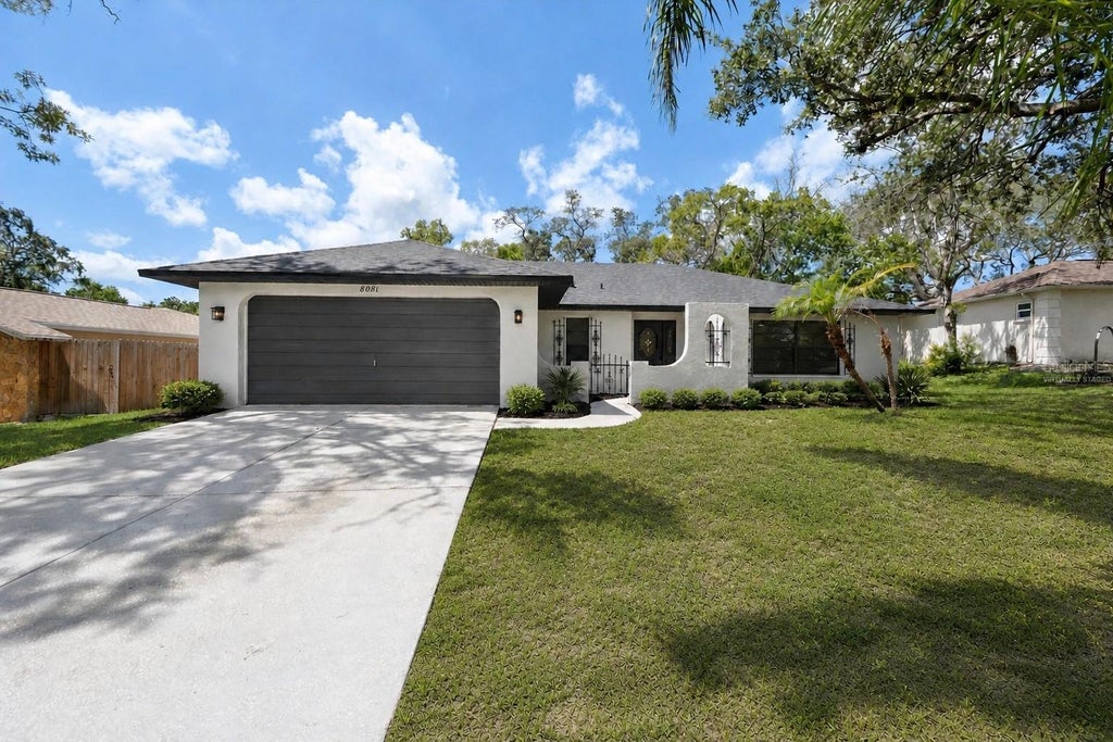 Photo of 8081 Wooden Drive, Spring Hill, FL 34606 (MLS # TB8530770)