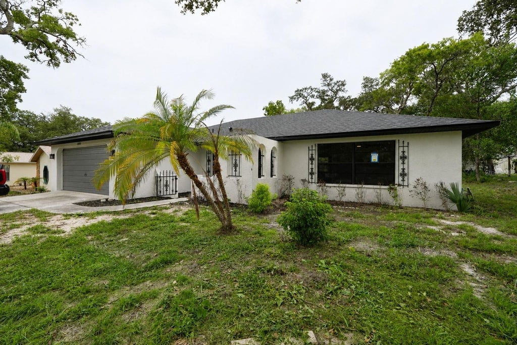 Photo of 8081 Wooden Drive, Spring Hill, FL 34606 (MLS # TB8530770)