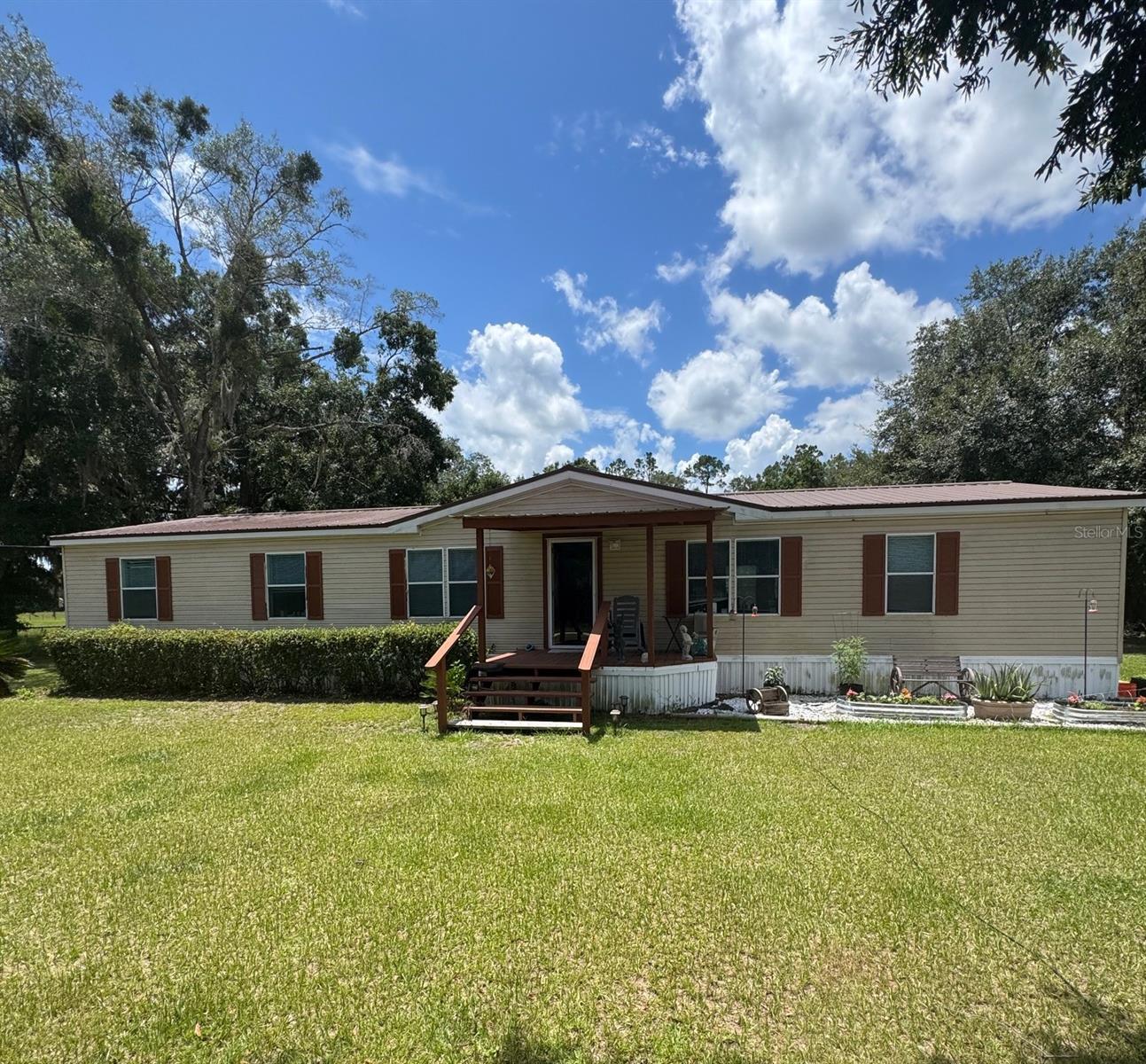 Charming Country Retreat on 3 Acres! beautifully updated 3 Bedroom, 2 Bath home nestled on a spacious 3-acre Agricultural-zoned property – bring your chickens, goats, horses, and more! Move-in Ready with brand NEW Flooring, a NEW AC, and a stunning NEW Covered Patio with Wood Deck – perfect for relaxing or entertaining! Need extra space or want passive income? You’ll love the Detached Guest House with its own private bathroom, separate septic system, and its own electric meter – ideal for guests or rental income! The property also features: Designated area for a chicken coop, Outdoor sink and storage shed, 2-Car Carport, Fully Fenced for Privacy and Pets. All this, just 10 minutes from I-75, supermarkets, and shopping – the perfect balance of peaceful country life and convenient city access. Whether you’re looking for a serene homestead or a smart income-producing property, this one has it all! Discover the perfect blend of comfort and country living. Schedule your private showing today before it’s gone!