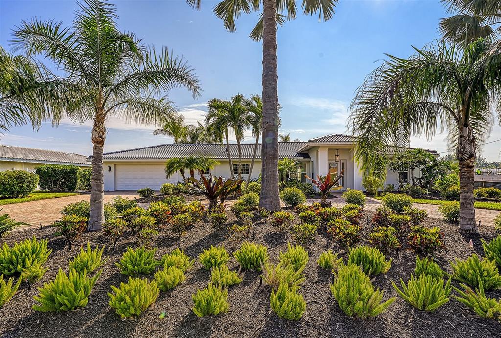 Just completed! Sparkling full renovation of this this Emerald Harbor jewel spared no expense. Enjoy bright spacious rooms with breezes from one of the widest canals on Longboat. Wolf and Sub-Zero appliances, designer lighting and plumbing fixtures throughout, beautiful quartz countertops with a massive kitchen island, all marble bathrooms, wood floors throughout, new pool deck and refinished pool, brand new seawall, dock, and lift – THIS HOUSE IS A BOATER’S DREAM! The wide canal at this location magnifies views and affords better privacy than most canal front locations. You won’t want to work from this home, but if you must then you will enjoy the dedicated office with extensive built ins and storage. Perfect location with proximity to all the best dining and recreation the north end has to offer. Deeded beach access is the cherry on top of this unrivaled opportunity to start enjoying your coastal Florida lifestyle!