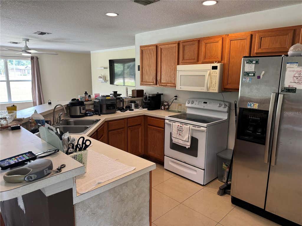 Photo of 609 Kissimmee Lane, Poinciana, FL 34759 (MLS # O6435205)