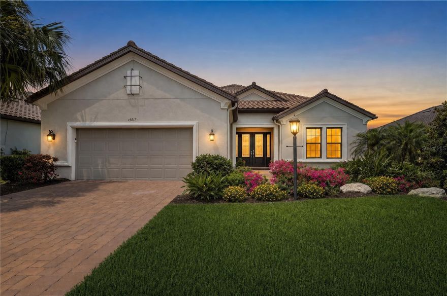 Enjoy breathtaking golf course and water views from this fully loaded 3 Bedroom, 3 Bath + Den Pallazio floor plan in the highly coveted Esplanade at Azario. Complete with a DEEDED GOLF MEMBERSHIP and showcasing an exceptional level of upgrades and designer finishes, this home truly offers the ultimate Florida luxury lifestyle. The spectacular outdoor living space is designed for both relaxation and entertaining, featuring a 31.5-foot gas-heated pool and spa, an oversized extended covered lanai, panoramic screen enclosure for unobstructed golf course and water views, two sets of pocket sliding glass doors for seamless indoor/outdoor living, a fully equipped outdoor kitchen, and elegant Shellstone pavers.  Inside, the gourmet kitchen is beautifully appointed with GE Profile stainless steel appliances, a GE Monogram wine refrigerator, gas cooktop, designer range hood, 42-inch upper cabinets, soft-close dovetail cabinetry, under-cabinet lighting, glass tile backsplash, and an oversized island perfect for gathering.  Additional upgrades throughout the home include designer lighting, quartz countertops, custom two-toned California Closets in the primary suite, garage, and storage systems, Lutron automated interior shades, 8-foot interior doors, tray ceilings, crown molding, and a luxurious primary bath with an oversized walk-in shower and rain shower head.  Additional features include a tankless gas water heater, tandem garage with abundant custom storage, and Nautilus pull-down hurricane shutters on all windows, with hurricane impact glass at the front of the home.
Come experience resort-style living at its finest in Esplanade at Azario.