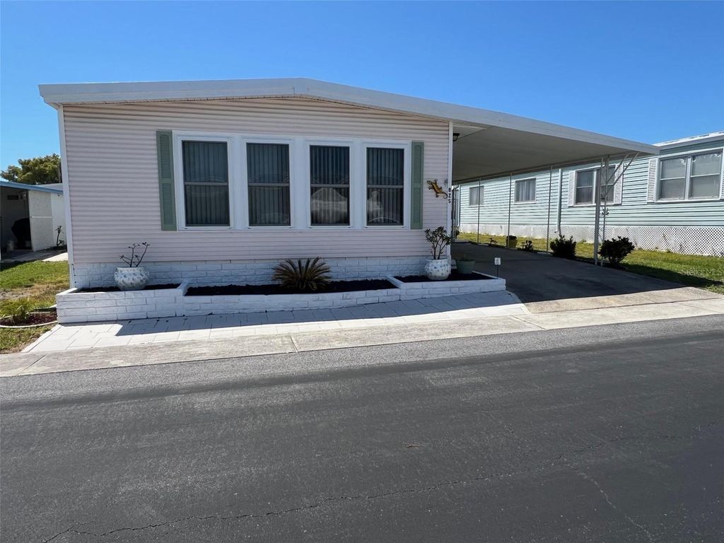 Photo of 825 Coconut Palm Street, Largo, FL 33778 (MLS # TB8374519)