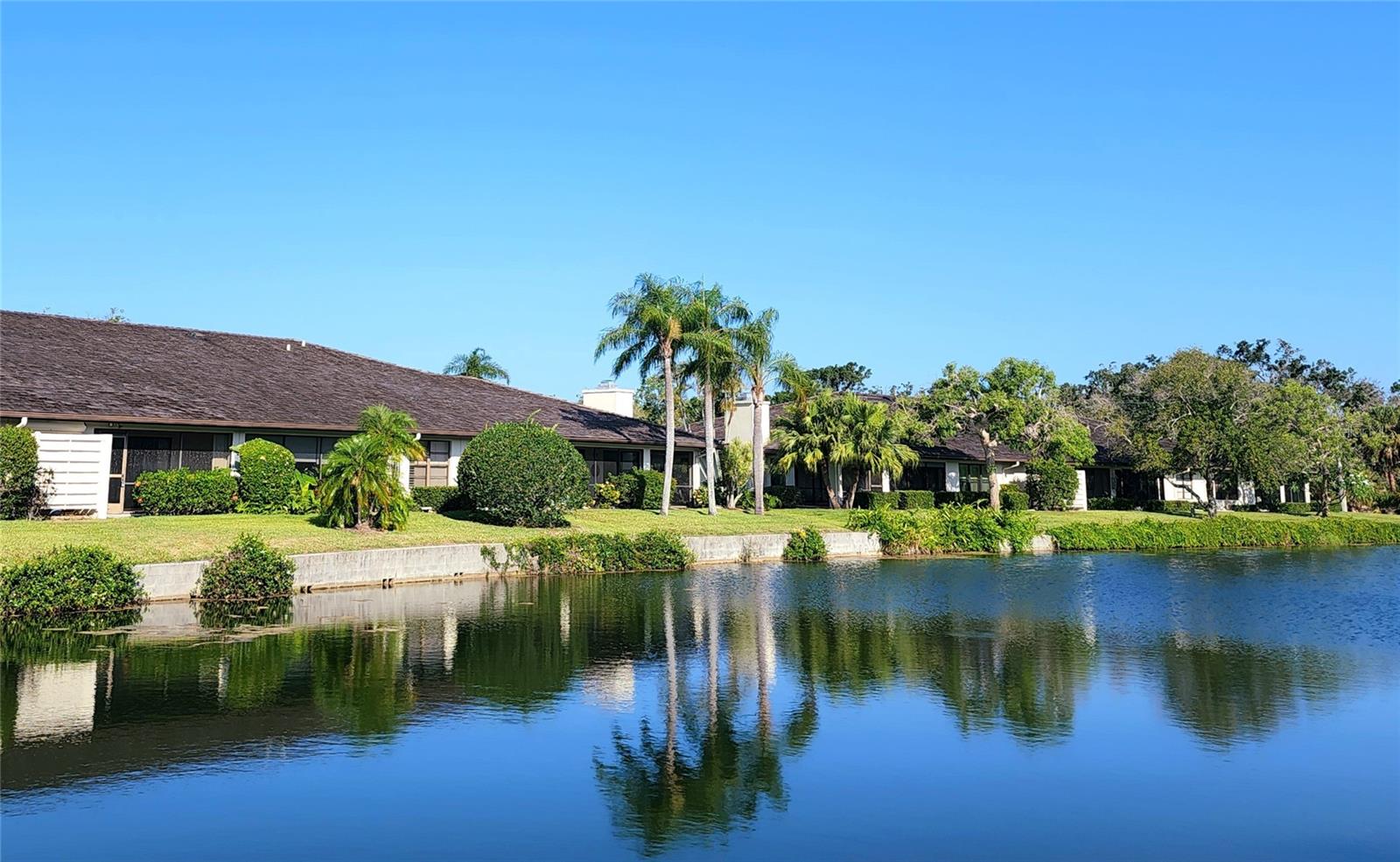 Lowest priced villa in Ballantrae and only 5 miles to Siesta Key beaches! Welcome to one of the most beautiful gated communities in desirable Palmer Ranch. This lovely 2/2 waterfront villa has a great layout and unique features. You’ll be treated to gorgeous sunrises from your living room and screened lanai that overlook the pond. Plant enthusiasts will especially enjoy atrium views from every room! The open living and dining room are perfect for entertaining. There is a dining area in the eat-in kitchen as well. The en-suite master bedroom is huge, measuring 18ftx16ft, with a walk-in closet and garden shower. The guest suite functions as a secondary master, with an en-suite bathroom and walk-in closet. Both bedrooms have sliding glass doors leading to the atrium patio! Washer/dryer are located in the spacious 2-car garage. New AC in 2021! Condo fees includes exterior painting, roof repair/replacement, landscaping, irrigation, and cable. This maintenance-free, all ages villa is close to everything Sarasota has to offer – beaches, shopping, restaurants and entertainment. Sarasota Sports Tennis & Swim Club is only ½ mile walk away, and Prestancia Golf Club is right around the corner! Less than 3 miles to the Legacy Trail. Schedule your private showing today.