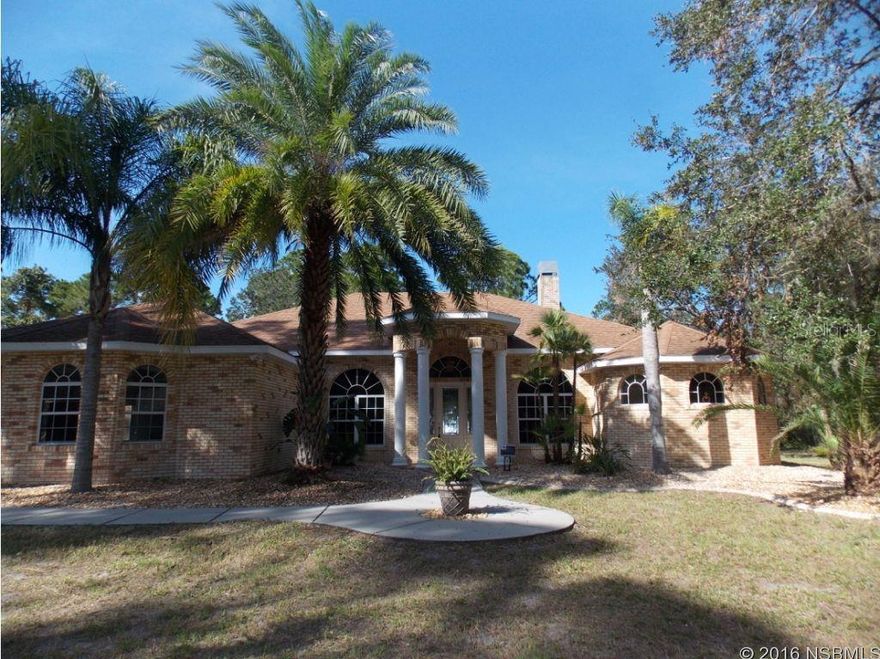 This beautiful brick home is nestled on a 3.1 acre building lot.  When you enter into the property you won't want to leave your piece of paradise.  The home features a very large kitchen perfect for the large family who likes to cook, granite counters, lots of cabinets, an island and more counter space then you can imagine.  Overlooking the family room that has a 2 sided fireplace shared with the master.  Home features vaulted ceilings and a split bedroom floor plan.  Master bedroom is extremely spacious and has a separate sitting area with some built in cabinets and refrigerator.  Master bath is very large and has his and hers sinks.  There is a 3 panel disappearing sliding glass door that opens to the back yard where you can enjoy the 48 x 10 porch for some relaxing evenings or your morning coffee.  You truly won't be disappointed in this property.