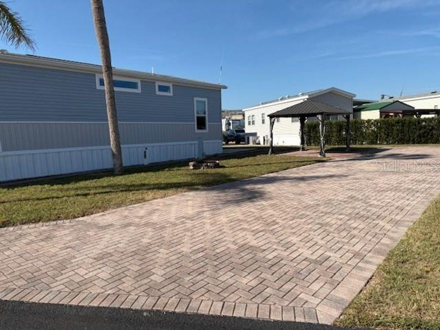 This perfect RV lot is near the bathhouse and shower in the much sought-after Elite Resorts at Citrus Valley. Lot 244 is located a short walk to the clubhouse, laundry and pool area. It is a spacious lot that has a gazebo and extra pavers with plenty of room for a 41 foot trailer to make it your own piece of paradise. The association allows RV's, sheds, ParkModels with porches and gazebos. A well maintained high quality resort that is only approximately 12 miles from Disney and 13 miles from the quaint downtown Clermont area with weekly farmers markets, food truck events and more. The resort also has two bath houses, laundry facilities, social events and entertainment. This property has the ability for short term rental to either use it part time and rent it the remanding the time or stay full time yourself. Call or email Diana for more information.