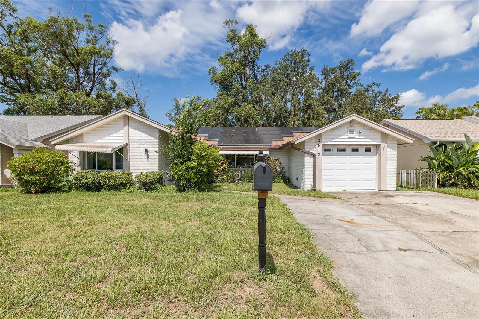 OPPORTUNITY AWAITS!!! Welcome Home to this spacious 2 POSSIBLE 3rd AND 4th bedroom 2-bath home located in the Beacon Square community of Holiday, Florida! Boasting 1,658 sq ft of living space, this home offers a thoughtful layout. BIG TICKET ITEMS ARE DONE! Upon entry you are welcomed with NEW Laminate flooring in the Front living and Dining area. The heart of the home is the open-concept kitchen, featuring brand-new stainless-steel appliances, generous cabinet and counter space, and a breakfast bar...Opens beautifully to both the family room and living room, ideal for hosting and everyday living. Need more space? You'll love the flexibility of the double bonus Florida room, perfect for a home office, gym, or easily a 3rd and 4th bedroom. The guest bedroom is conveniently located near the front of the home, adjacent to the guest bath, while the primary suite is tucked privately in the back with a walk-in closet and an En suite bathroom featuring a stand-up shower. Enjoy new flooring in the main living areas, a fully fenced backyard with mature landscaping for added privacy, and recent big-ticket upgrades Including: Roof (2020) A/C (2019) Water Heater (2022) Newer Solar System (2021) – average electric bill around $45/month and ready to be transferred to the new owner! Best part of it all you are just minutes from the Gulf beaches, parks, boating, walking trails, and US Highway 19 for an easy commute. Don’t miss this opportunity to own this great home in ideal location! SCHEDULED YOUR PRIVATE TOUR TODAY!
