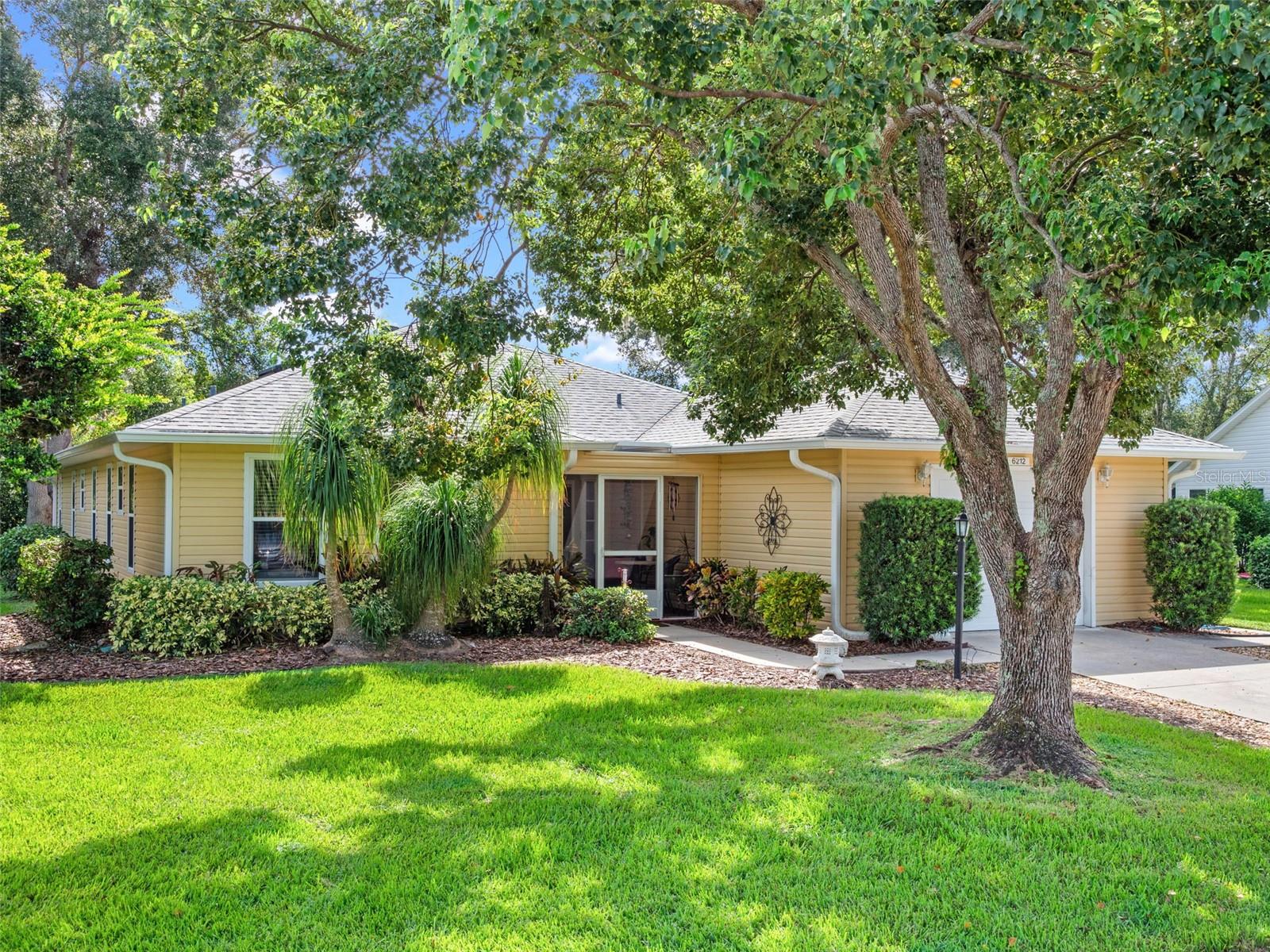 NO REAR NEIGHBOR! This RENOVATED 3 bedrooms, 2 bath home features screen enclosed COURT-YARD ENTRY, NEW DOUBLE PANE, DOUBLE DOOR and side light entry that greets you with an open floor plan with tiled floors throughout (NO carpet)! GRANITE kitchen counters, CHERRY cabinets, all appliances, eat-in kitchen/dinette space, breakfast bar/island over-look the family room. Split bedrooms with the Primary Retreat located at the rear of the home and has an en suite bath, walk-in closet and direct access to the family room. Lots of windows make for a light and bright feel, while over-looking the green space/conservation area beyond the home. There's even an open patio to enjoy the outdoors. Separate dining room also has soothing views of the outdoors and is light and bright. Bedrooms two and three, at the front of the home, share an updated guest bath in the hall with new vanity and a shower-tub combination. An interior laundry room comes complete with washer and dryer. Don't let this OVER-SIZED single car garage deter you; it boasts 486 square feet... more like a 2-car garage. The lot is landscaped and well maintained, like the home. ROOF 2020! HVAC 2016! WATER HEATER 2024! UPDATED electrical panel to Siemens. Solar tube in living room offers lots of natural lighting. FURNITURE OPTIONAL!
Highland Lakes is a gated 55+ community situated in Central Florida just south of Leesburg & offers residents the following amenities: Recreational Clubhouse with two swimming pools; indoor (heated) & outdoor, a softball field complete with concession stand, an indoor arena with a stage for comm. events, complete kitchen, billiard/ping pong rm., 4 tennis courts (2 courts are lighted), 1 indoor tennis court, 8 lighted shuffle board courts, bocce ball courts, 2 outdoor and 4 indoor pickleball courts, 7 horseshoe pits, covered picnic pavilion with picnic tables & grills to barbeque, library, meeting/card room, exercise room/fitness, craft room, golf driving range, RV/boat storage (included in HOA) & has 260 spaces on a secured lot (fenced & lockable), a Craftsmen building/woodworking shop (homeowners can join the club for only $12 annually and use any/all tools available), there's also a Nature Trail within the community & seven lakes scattered throughout Highland Lakes; 4 are used by residents for catch & release fishing! Don't wait............. call now to schedule your private tour!