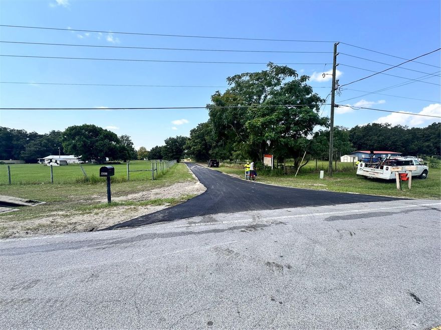 Don't miss out on this little slice of heaven right on a Lake! This is the perfect 8.37 Acres you've been looking for! It has a brand new private paved road to the property. The property has been cleaned and cleared and ready for a Beautiful home. Smith Lake is a private stocked  lake with limited access to the public with the privacy gates and fencing around the lake. Rolling acreage with beautiful Oak Trees, Bahia grass, a temporary electric pole, and existing septic.