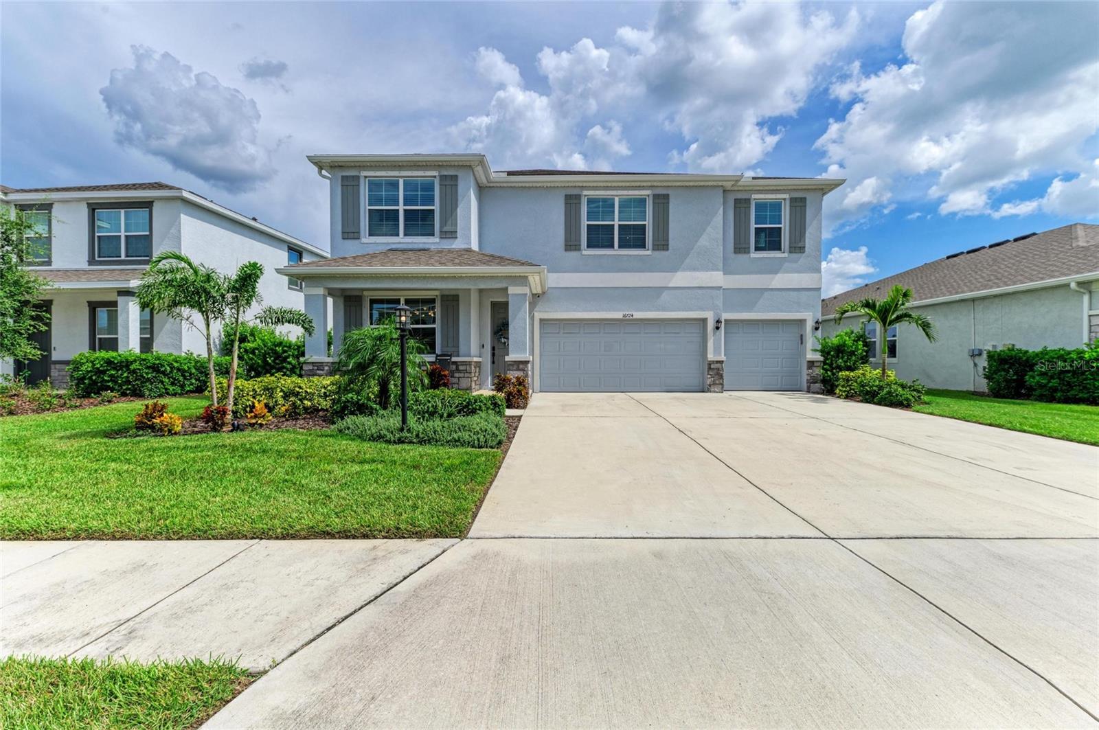 Stunning Luxury Home in Star Farms at Lakewood Ranch. Welcome to this exquisite 5-bedroom, 4.5-bath residence boasting over 4,000 sq. ft. of beautifully designed living space. Perfectly positioned on one of the most sought-after water lots with southern exposure, this home offers both elegance and comfort. Step inside to discover a gourmet chef’s kitchen featuring stainless steel appliances, granite countertops, an oversized island and a walk-in pantry with custom cabinetry. The dinette seamlessly flows into the spacious great room, accented by a custom fireplace, opening to a covered, screened-in lanai ideal for indoor-outdoor living. The first floor guest suite with full bath is perfect for visitors, while the luxurious primary suite includes dual custom walk-in closets and a spa-inspired ensuite bath with convenient access to the laundry room also with custom cabinets. Upstairs, you’ll find three additional bedrooms (one with an ensuite), a grand bonus room, and plenty of space to live and entertain. Additional highlights include: Custom mudroom with cabinetry, designer wood accent walls, a whole-home water filtration system & water softener. Brand-new tankless water heater. 3-car garage with epoxy flooring. This exceptional property combines luxury, functionality, and Florida living at its finest—all within the highly desirable Star Farms community of Lakewood Ranch. Lifestyle at Star Farms: Nestled within the award-winning master-planned community of Lakewood Ranch, Star Farms is a 700-acre gated neighborhood designed for resort-style living. Residents enjoy world-class amenities, including: The Resort Club & Poolside Bar & Grill - Multiple resort-style pools, splash pad & private cabanas - Fitness Center & Athletic Performance Center- Sports courts for tennis, pickleball, basketball & baseball - Sand volleyball, playgrounds & outdoor grilling areas- The Event Center & Terrace Chef’s Patio -Trade Route Coffee Kitchen- Junction Place & Cabana Corner with golf cart parking- dedicated Pet Park. At Star Farms, every detail is designed to elevate daily living—where elegance, recreation, and community come together in perfect harmony.