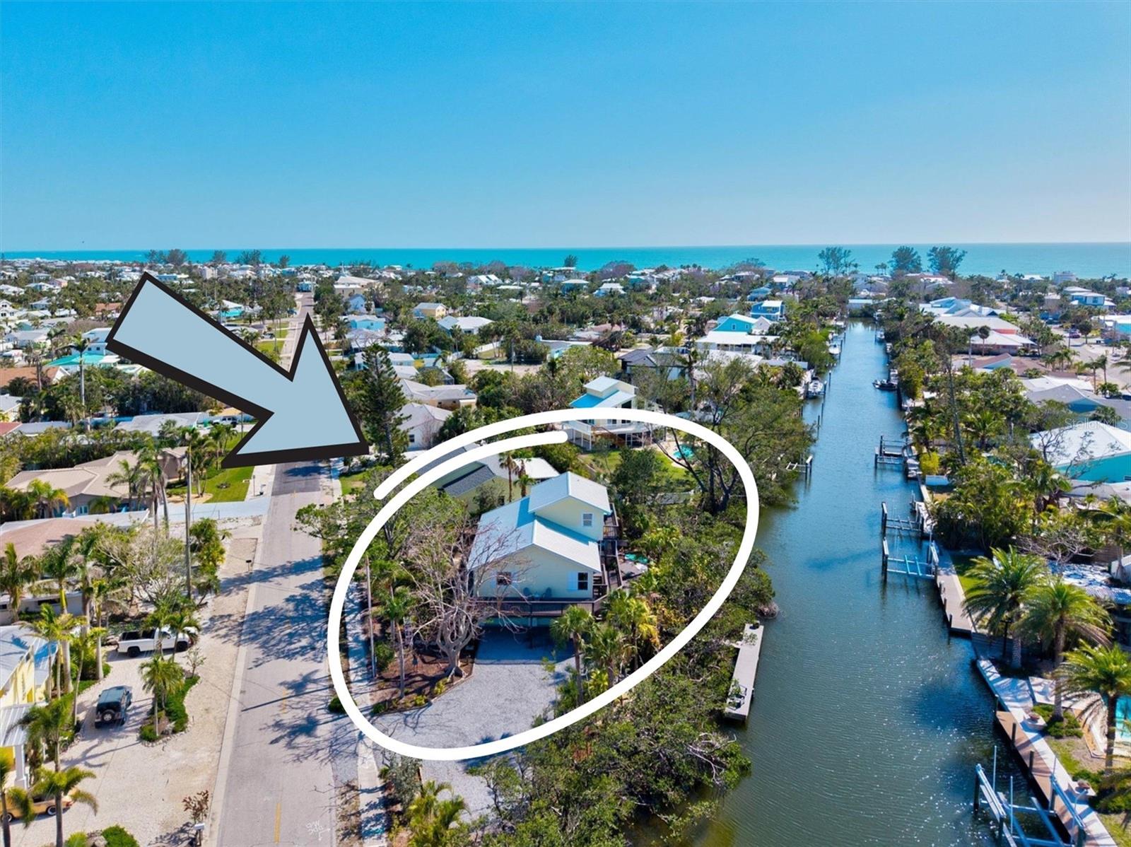 Tucked away on a quiet, picturesque street in the heart of Holmes Beach, this ELEVATED WATERFRONT retreat offers a rare private coastal sanctuary. Perfectly positioned on a sprawling 225-foot waterfront SAILBOAT-DEPTH CANAL with NO FIXED BRIDGES and DIRECT ACCESS to Bimini Bay, the Intracoastal Waterway, and the shimmering GULF OF MEXICO. Wrapped in lush, tropical landscaping and framed by a natural mangrove shoreline, a 40+ ft TimberTech COMPOSITE DOCK stretches gracefully into the water; ready to welcome your large boat or sailboat. What sets this home apart is not just its breathtaking setting, but the peace of mind it offers. ELEVATED and STORM-TESTED, this home proudly boasts ZERO HURRICANE DAMAGE - a true rarity on the island. Built with an impressive LIST OF UPGRADES for ultimate resilience: breakaway garage walls REINFORCED with CONCRETE SUPPORTS, a 2023 standing seam ALUMINUM ROOF with underlayment that is MIAMI-DADE STANDARDS, HURRICANE-IMPACT windows and doors with UV protection, and hidden vent soffits and fascia. Step inside and feel the relaxed elegance of this coastal gem. SUNLIGHT floods through every room, dancing off the stunning plank-style porcelain tile floors and creating a warm, inviting atmosphere. The OPEN CONCEPT great room flows seamlessly into a beautifully updated kitchen where your inner chef can run wild. Outfitted with rich maple cabinetry, sparkling Quartz countertops, and top-tier stainless steel appliances. The oversized walk-in pantry is perfect for keeping all your culinary essentials tucked away. The home's bathrooms echo the same attention to detail, featuring gorgeous tilework, granite countertops, upgraded Toto commodes, and brand-new copper piping and plumbing (2025). Every corner has been meticulously cared but it’s the outdoor living that truly sets this property apart. Your private backyard oasis was designed for both relaxation and unforgettable entertaining. Expansive WRAP-AROUND DECKING, crafted from premium materials and beautifully maintained, offers plenty of space to gather with family and friends. The FENCED IN DECKING also is perfect for pets to roam safely, while the CUSTOM KAYAK LAUNCH invites spontaneous paddles through the tranquil canal waters. Dreaming of a pool? APPROVED PLANS are ready and waiting to transform this outdoor space into your personal tropical paradise. Down at the dock, life slows down. Watch dolphins play, drop a line, or simply sip a cool drink as the sun melts into the Gulf horizon. The wide canal offers ample space for larger vessels - a true rarity on the island. Additional features include a spacious 3-CAR GARAGE with TWO LARGE STORAGE areas perfect for paddleboards, fishing gear, or even a golf cart. Conveniently, a 50-amp outlet has been installed for a RV, boat lift or even a hot tub. Ample guest parking is a major plus when it comes to this property and could even accommodate a RV, boat with trailer or whatever your heart desires! Plus a proactive termite protection system. Best of all? This serene retreat is just a short stroll to the sugar-sand beaches of Anna Maria Island, charming local shops, and island-favorite restaurants - all easily accessible via the free island trolley. Whether you’re searching for a full-time coastal residence, a seasonal getaway, or a savvy investment (zoned R-1 with 30-day minimum rentals), this home checks every box. Come experience the magic of Holmes Beach waterfront living where every day feels like a vacation.