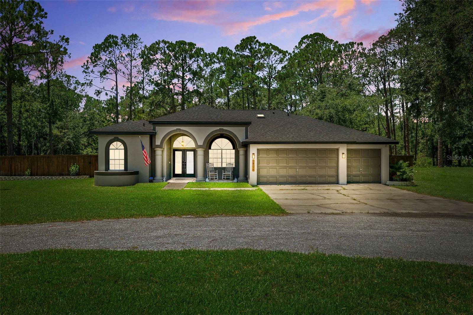 Welcome home to your slice of Florida Country Living just minutes from in-town amenities. NEW ROOF 2024, NEW AC 2023, NEW WHOLE HOUSE WATER SYSTEM AND WATER HEATER 2024. Exceptional properties like this are very few and far between – blending the benefits of large parcel, 4 bed 3 bath, NO HOA, NO CDD, country style living with the proximity to shopping, schools, highway access and everything the modern life requires! Situated on nearly 5 acres of exquisite Florida land – the possibilities are endless! Meticulously renovated from top to bottom – this once neglected home has been through every possible improvement; flooring, roof, septic, kitchen and baths, edited floor plan to include a blended butler/homesteader pantry and laundry; not to mention upscale cosmetics like fabulous landscaping, timeless coffered ceiling throughout the open living spaces, rejuvenated yard which is now fully fenced for privacy without damaging the serene woodland views from your covered patio and shimmering pool. This property will make you the envy of the family – with 3 full guest rooms, and 2 separate guest baths, entertaining and hosting has never been easier. The spacious circular drive provides ample parking, plus the oversized 3 car garage is just the tip of the vehicle and workshop iceberg! This property also has an auxillary drive to the rear of the home for RV/toy parking in front of ANOTHER full 3 bay workshop measuring 24X34. Words cannot express the peace that envelopes this property through and through – watch deer and Sand Hill Cranes from the comfort of your lanai. Less than 5 minutes to The Grove and KRATE; you’re barely a car ride away from anything you could possibly need; World Market, Best Buy, BEALLS, ULTA Beauty, Planet Fitness, Michaels Crafts, TJ MAXX, Old Navy, 5Below, PetsMart and Dicks Sporting Goods! Don’t miss this fantastic property – call today for a private viewing.
