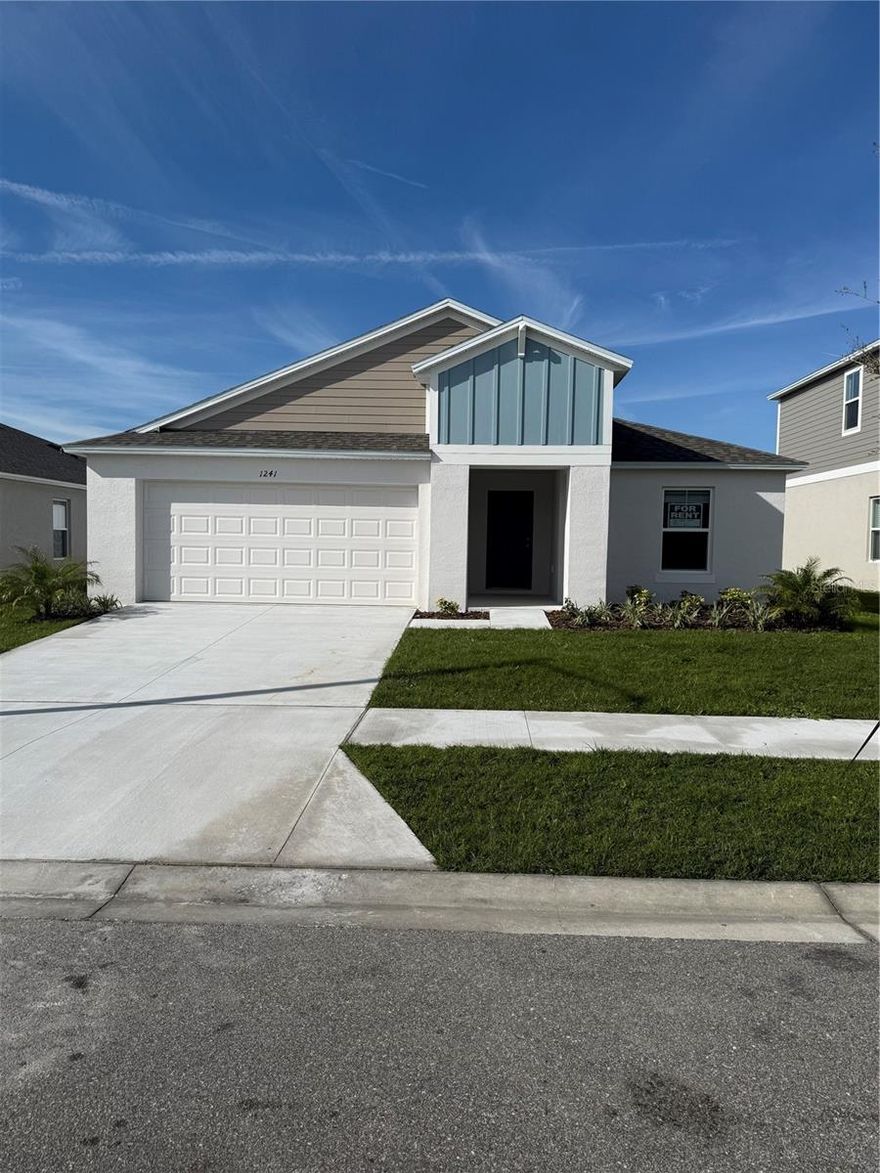 Be the first to live in this beautiful brand new 4 bedroom, 2 bathroom home with a 2 car garage. The welcoming entryway leads to three bedrooms, a full bath, and a laundry room complete with washer and dryer. Enjoy an open and airy floor plan with vaulted ceilings, perfect for entertaining or relaxing nights at home. The kitchen boasts quartz countertops, stainless steel appliances, and stylish luxury vinyl plank flooring. Sliding glass doors open to a covered lanai, offering great indoor outdoor flow. The private owner’s suite is generously sized and features a dual vanity, walk-in shower, and oversized walk-in closet. Conveniently located close to shopping, restaurants, and major highways.