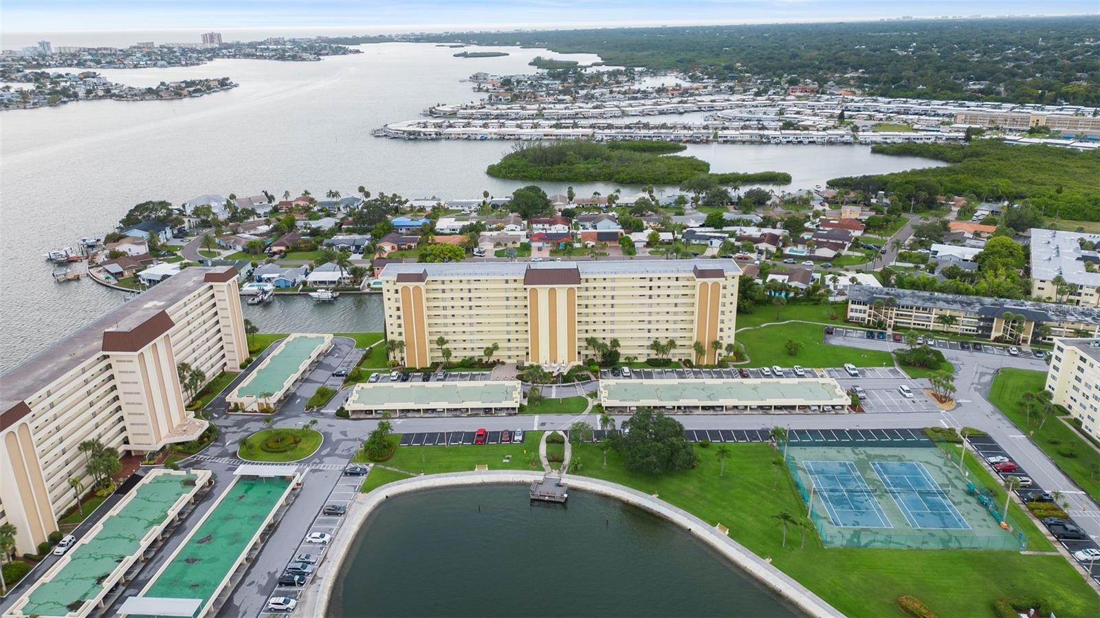 Welcome to your new home in this adult waterfront community overlooking the intracoastal. Enjoy front row seats to the annual Christmas boat parade, the Veterans day boat parade and daily dolphin sightings. This beautifully remodeled 2 bed/2bath condo features open kitchen with quartz countertops, stainless steel appliances and recessed lighting. This condo also has Luxury Vinyl flooring, newer A/C and hurricane shutters. Enjoy quiet peaceful living at is best and Sea Towers offers a very active community . Amenities include two heated pools, tennis and shuffleboard courts, putting green, BBQ grills and more.