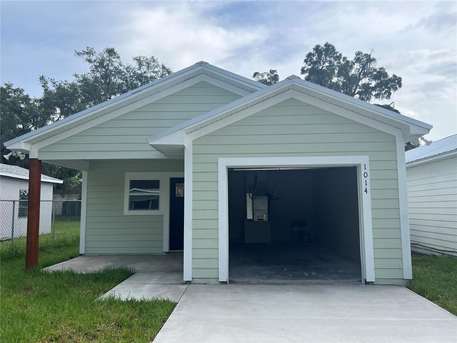 NEW CONSTRUCTION COMPLETED and MOVE IN READY ! METAL ROOF with a 35 YEAR WARRANTY. This adorable downtown Eustis home has a spacious open floor plan with vaulted ceiling, combining a fully equipped kitchen with dining and living areas. The kitchen features shaker kitchen cabinets with quartz counter tops and a complete stainless steel kitchen appliance package. Lighted ceiling fans are located throughout the home which also features an indoor laundry space and a tank less water heater. The primary bedroom has a private en suite bath and walk-in closet. This home has convenient access to downtown Eustis and its public park on Lake Eustis. Mount Dora, Tavares and surrounding communities host many cultural and art events. Lake County is known for its huge chain of lakes with unlimited water sports, and many parks and nature trails. Eustis has small town ambience with big city convenience, and easy access to highways leading to the Orlando metro area, theme parks and many Florida beaches. ***More photos and aerials coming by 08/01***