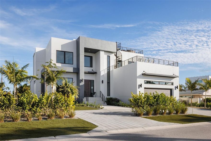 Move-in ready new construction in Lido Shores just steps from the private neighborhood beach. Skip the two-year building process and move straight into a brand new residence designed for effortless coastal living.

Clean architectural lines, walls of glass, and an open yet thoughtfully scaled floor plan create a home that feels both modern and comfortable. The main living spaces flow seamlessly to the spa, pool and outdoor entertaining areas, creating a natural connection between indoor and outdoor living.

At the center of the home, the kitchen is designed as both a showpiece and gathering space, featuring Thermador appliances, custom Italian cabinetry, and an oversized island ideal for entertaining. Generous living and dining areas allow the home to host comfortably without sacrificing privacy or everyday livability.

Each of the five bedrooms offers its own en-suite bath, creating private retreats for family and guests alike. The primary suite is designed as a true sanctuary, featuring spa-inspired finishes and a calm connection to the surrounding outdoor spaces.

One of the home’s most special features is the expansive rooftop terrace, offering sunset views toward the Gulf and a unique setting for evening entertaining or quiet moments above the neighborhood canopy.

Built by Seaward Homes and completed in 2024, the residence also includes smart home integration, custom closets and thoughtfully curated finishes throughout.

Located in Lido Shores, one of Sarasota’s most sought-after coastal neighborhoods, residents enjoy private beach access along with convenient proximity to St. Armands Circle, downtown Sarasota, and the city’s renowned dining and cultural destinations.

Recently completed and ready for immediate occupancy, this home presents a rare opportunity to enjoy brand new construction in Lido Shores without the time, complexity, and rising costs of building.