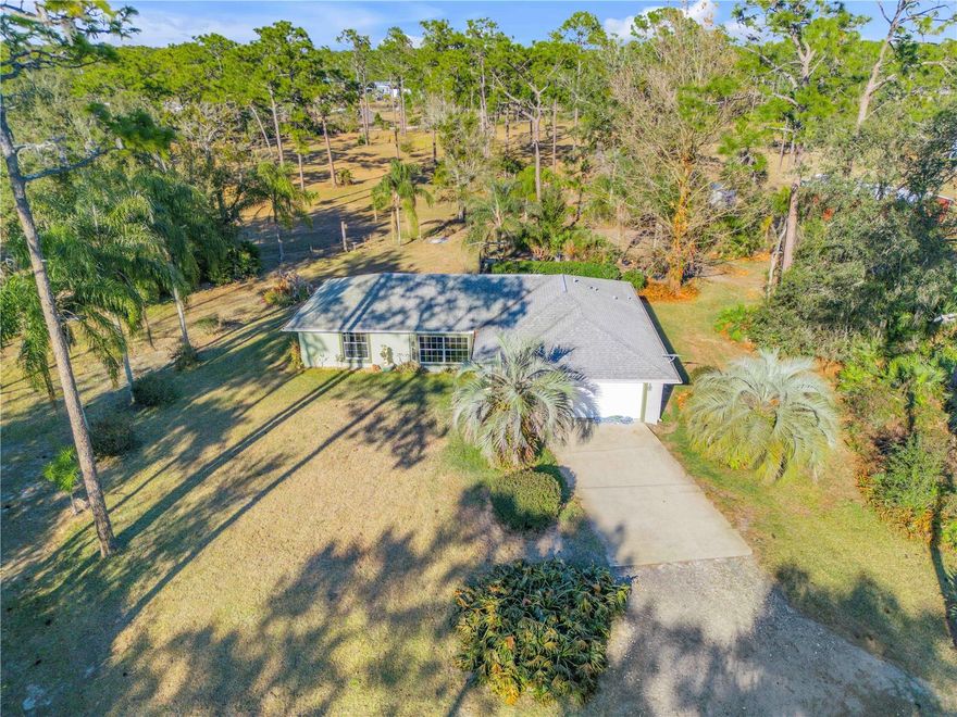 Experience the best of country living with this private 9.7-acre property in the highly desirable Lake Ashby area of New Smyrna Beach. This well-maintained 3 bedroom, 2 bathroom home offers just under 1,500 square feet of living space and features an attached 2-car garage, providing comfort, functionality, and room to grow.

A standout feature of this property is the impressive 60x30 detached garage—perfect for storing equipment, vehicles, recreational toys, or creating the ultimate workshop. In addition, a 33x13 metal carport provides excellent covered storage for a boat, RV, or additional vehicles.

The expansive acreage offers endless opportunities for outdoor living, recreation, or creating your own private estate. With plenty of room for hobbies, equipment, animals, or future expansion, this property is ideal for those seeking privacy, space, and versatility while still being conveniently located within reach of New Smyrna Beach, shopping, dining, and the coast.

Whether you’re looking for a full-time residence, hobby farm potential, or a private retreat, this Lake Ashby property offers a rare combination of acreage, outbuildings, and peaceful Florida living.