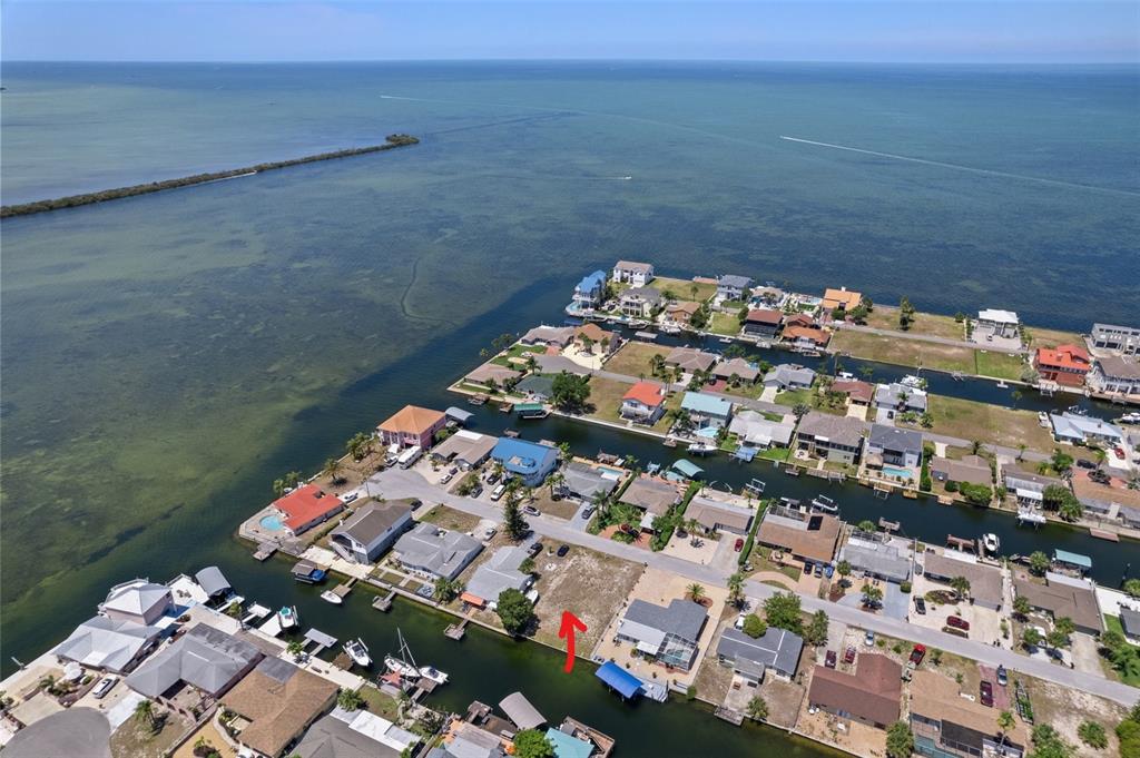 WATERFRONT CANAL LOT WITH SEAWALL. WILL HAVE GULF VIEWS IF BUILT UPON. STREET LIGHTING WITH UNDERGROUND UTILITIES. SEWER HOOK UP PREPAID.