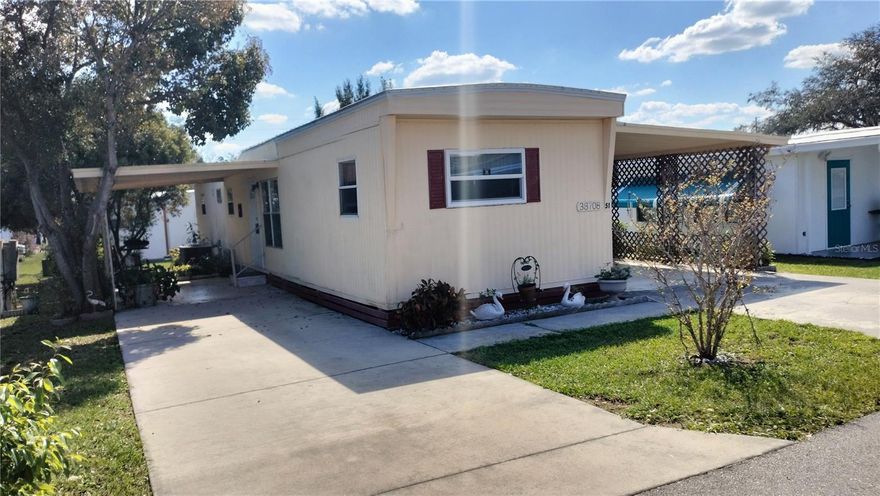 Motivated Seller, Flash Sale! 2-bedroom, 2 bath single wide home with an additional living space, storage and covered patio/carport. In the front of the home is a primary suite.  In the back of the home is the other bathroom and another bedroom that can easily serve as a guest room or cozy office, providing versatility to suit your lifestyle.  Off the hallway, you can step down into another spacious living area with a laundry area. There is also an additional storage shed at the back of the property. This home has so many opportunities and is very spacious. Come and enjoy the welcoming 55+ community, leisurely strolls along the well-maintained gardens outside where the vibe shines through! Take a dip in the community pool or enjoy the clubhouse, with social events and friendly neighbors. Welcome to a vibrant, active community.