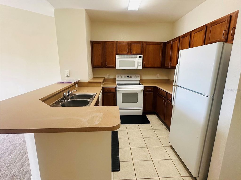Photo of 8124 Claire Ann Drive #305, Orlando, FL 32825 (MLS # O6419270)