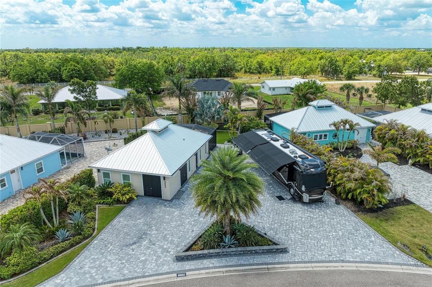 Start your journey with us at this beautiful property, Lot 51, in Thornton Creek Motorcoach Resort. This custom-designed Coach House offers 1,000 square feet under A/C and a 375-square-foot screened lanai—tailored just for you. The spacious kitchen is perfect for cooking, gathering, and connecting, while the bright and comfortable living area features sliding floor to ceiling glass doors that open to stunning garden views of your own privacy retreat lot. The home includes a spacious primary suite, a full bathroom, a laundry area, a golf cart garage, and a generous RV pad. This is a one in a lifetime opportunity to own one of the most spacious lots at Thornton Creek.  The community amenities include a clubhouse with a pool, gym, mailroom, laundry facilities, and social spaces where you can enjoy time with friends. Don’t wait—call today to schedule your private tour.