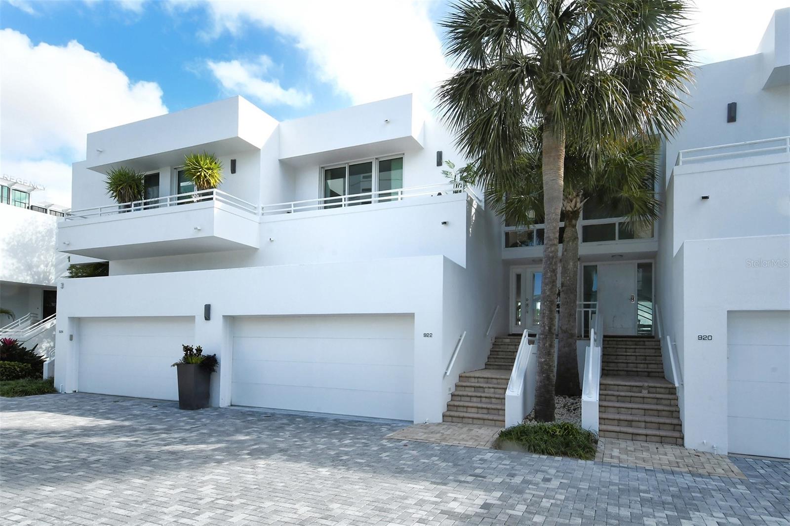 Annual townhouse available for lease in downtown Sarasota, right on the bay! The townhouse combines gorgeous water views with downtown convenience and in the beautiful community of Marina Suites at end of Blvd of the Arts. The home features beautiful maple wood engineered flooring, a newly remodeled kitchen with Sub-Zero and Wolf appliances, and marble and travertine throughout. An open circular staircase from the ground to third floor is capped with a skylight that brings light into the entire space. The top level includes the main with luxurious spa-like en-suite bath, a guest bedroom with an en-suite bath and space in between for an office. The middle level features an open great room with a built-in bar ideal for entertaining guests, an open kitchen and dining room, all with views of the water. The first level includes a guest suite with room for office/living space with bedroom, private patio and bath—square footage on this floor is not included in listed square footage. A laundry room off the kitchen leads to a two-car garage with plenty of storage above. Community amenities include resort-style heated pools, tennis, exercise areas, boat/kayak docks and a 24-hour staffed security gatehouse. Just .9 miles to Main Street, three miles to St. Armands and 3.5 miles to Lido Beach. Go to the Hyatt, The Van Wezel, the waterfront park, the Ritz and more.