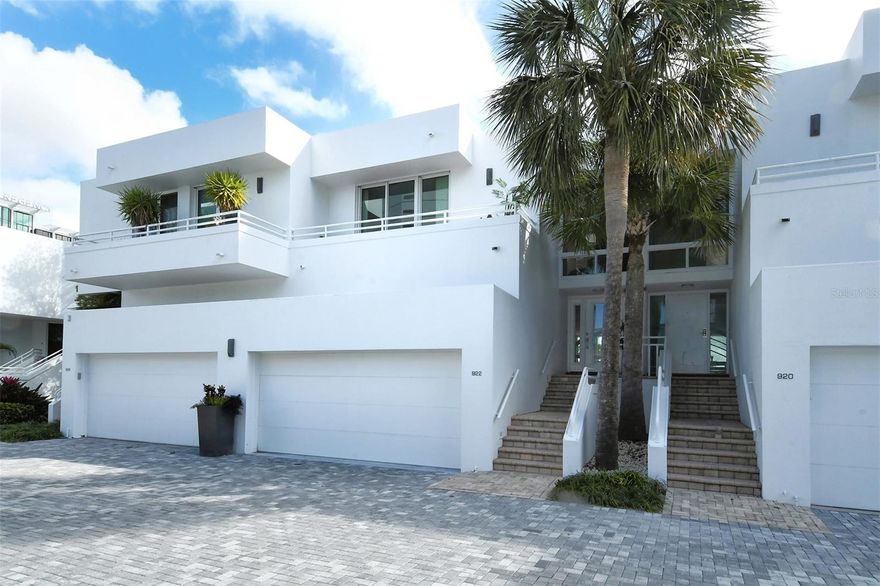 Annual unfurnished townhouse available for lease in downtown Sarasota, right on the bay! The townhouse combines gorgeous water views with downtown convenience and in the beautiful community of Marina Suites at end of Blvd of the Arts. The 16,000 lb boat lift can hold a boat up to 40ft to 44ft and is available for an additional $1000 per month.  The home features beautiful maple wood engineered flooring, a newly remodeled kitchen with Sub-Zero and Wolf appliances, and marble and travertine throughout. An open circular staircase from the ground to third floor is capped with a skylight that brings light into the entire space. The top level includes the main with luxurious spa-like en-suite bath, a guest bedroom with an en-suite bath and space in between for an office. The middle level features an open great room with a built-in bar ideal for entertaining guests, an open kitchen and dining room, all with views of the water. The first level includes a guest suite with room for office/living space with bedroom, private patio and bath—square footage on this floor is not included in listed square footage. A laundry room off the kitchen leads to a two-car garage with plenty of storage above. Community amenities include resort-style heated pools, tennis, exercise areas, boat/kayak docks and a 24-hour staffed security gatehouse. Just .9 miles to Main Street, three miles to St. Armands and 3.5 miles to Lido Beach. Go to the Hyatt, The Van Wezel, the waterfront park, the Ritz and more.