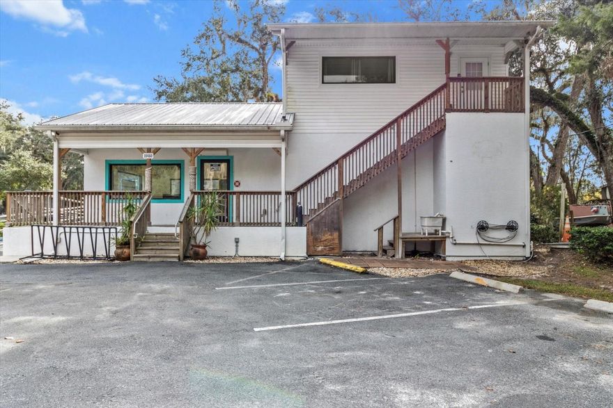 Commercial property in the heart of Homosassa NEVER FLOODED and OWNER FINANCING AVAILABLE! This golf carting community is known for its world class fishing and tourism! Upstairs living quarters is currently being used for a VACATION RENTAL that is booked out to March 2025. With this property being zoned CLC the business opportunities are endless. Building is handicap accessible with ramp, rails, and bathroom. Upstairs has full kitchen and bathroom that has been recently renovated. Don't miss this chance to own a prime piece of Homosassa for your starter or existing business!