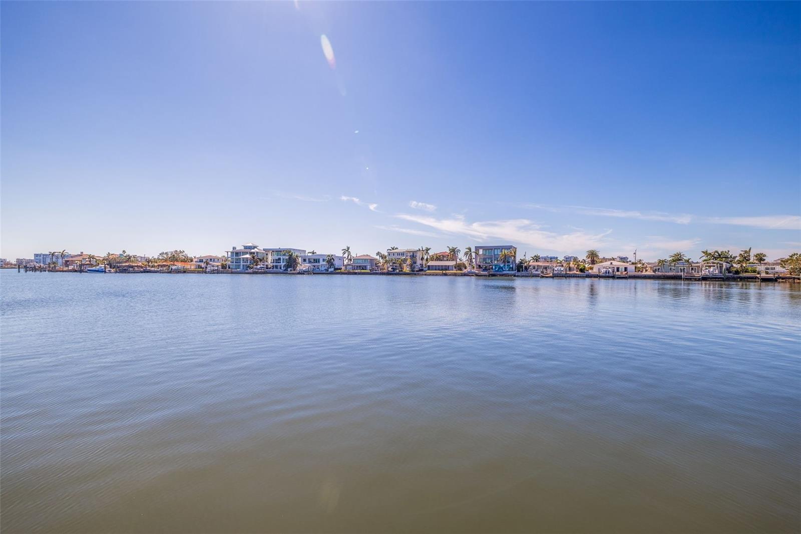 This is the waterfront lot you've been waiting for! The existing home has been demolished, and the lot has been cleared, making it ready for you to build your dream home on this premium parcel with stunning water views and direct Gulf access. Located in the highly coveted Yacht Club Estates, this boater’s paradise features deep water with no fixed bridges, making it ideal for accommodating large boats or sailboats. Surrounded by some of St. Petersburg’s most luxurious waterfront estates, this property offers a rare opportunity to design and construct your own custom coastal retreat. The seawall is in excellent condition, providing a strong foundation for your vision. Enjoy the perfect balance of serene waterfront living and unbeatable convenience. Just minutes from Treasure Island’s pristine beaches and the vibrant downtown St. Petersburg, you’ll have access to world-class dining, entertainment, and recreational activities. With new construction homes transforming Yacht Club Estates into a showcase of modern luxury, this lot is your chance to join one of the most prestigious communities in the area. Don’t miss out on owning a piece of paradise—contact us today to explore the endless possibilities!