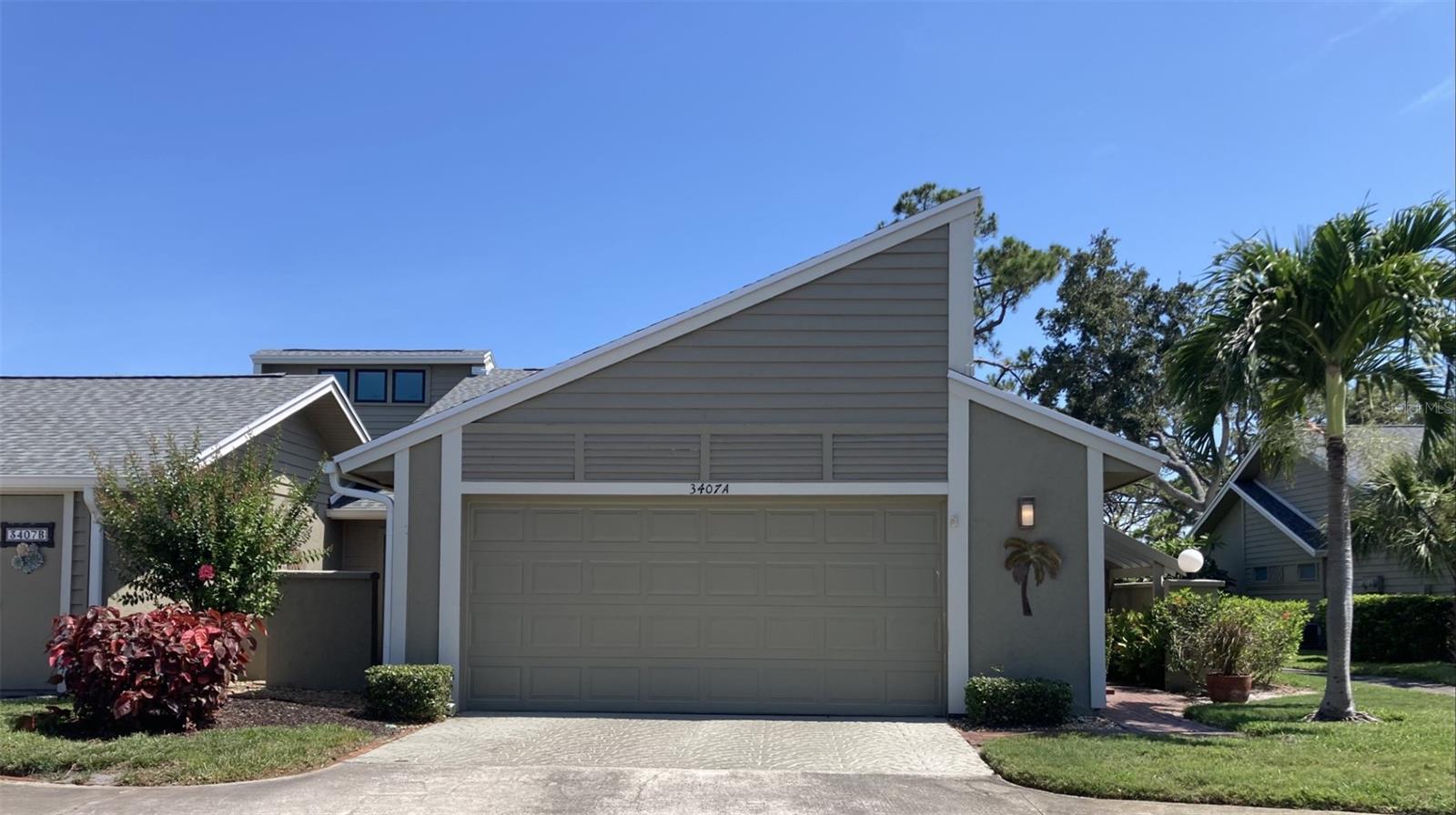 This three bedroom - two bath villa is located on the 4th fairway at the IMG Country Club. It is very spacious with an open floor plan. The kitchen has been remodeled with new cabinets, Corian countertops and stainless steel appliances. It also includes extra cabinets, including a wine cooler and a breakfast bar that seats two. There are sliding glass doors to a screened porch with tile floors and leads to an outside deck - perfect for sunning and grilling. The living room is completed with sliding doors to the deck and features a fireplace. Off the formal dining room is a pretty landscaped atrium. The master bedroom has sliding doors to a patio area and has it's own bathroom which has a walk-in shower, tub and dual sinks. There is a walk-in closet plus another closet. There are vaulted ceilings in the living room, dining room, kitchen and master bedroom. Across the street from the villa is the heated pool. The villa is in the IMG Country Club area which has an 18 hole regulation golf course and a beautiful clubhouse with grill room and dining room overlooking Sarasota Bay. The course is semi-private, open to the public along with the clubhouse. On El Conquistador parkway is also a tennis club. It is approximately 8 miles to the beach. The community is close to IMG Academy, State College of Florida and other schools. Shopping is close by and Sarasota is about 15 minutes away. It is a perfect location!