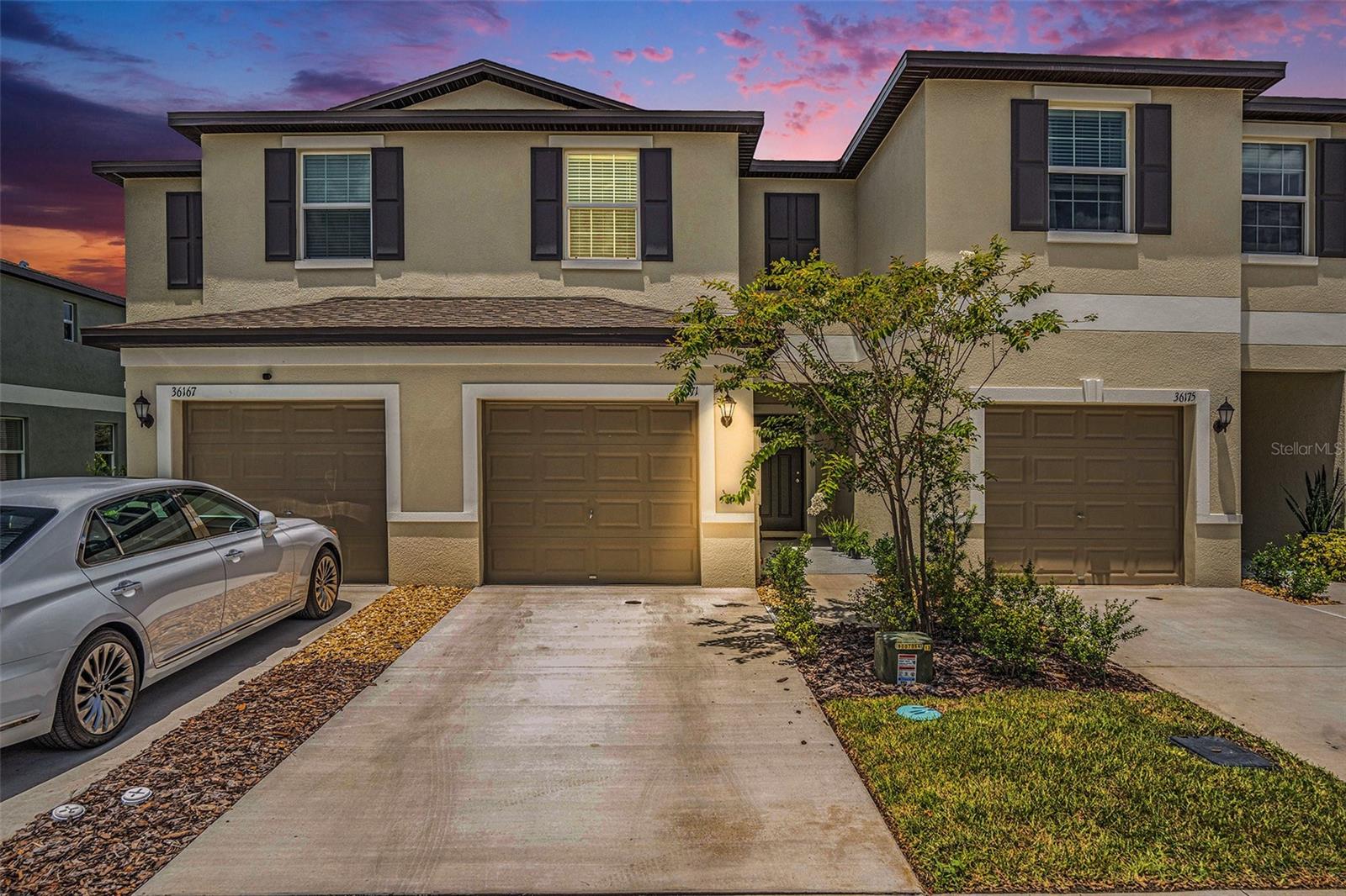 LIKE NEW !!! Discover your dream home in this breathtaking, 2-bedroom, 2.5-bath townhome, where modern elegance meets ultimate comfort in the vibrant Townes at Windsong community in Zephyrhills, FL! This move-in-ready masterpiece dazzles with soaring high ceilings, flooding the open-concept living space with natural light, and a serene screened lanai showcasing tranquil pond views—your personal oasis for relaxation. The gourmet kitchen is a chef’s delight, boasting sleek stone countertops, chic shaker-style cabinets, a generous closet pantry, a breakfast bar, and all appliances included for effortless living. Upstairs, the expansive primary suite is a true retreat, featuring a spacious walk-in closet and a luxurious en-suite bathroom with a double-sink vanity and a spa-inspired walk-in shower. The thoughtfully designed split bedroom layout ensures privacy, while a versatile loft space offers the perfect flex area for a home office, cozy reading nook, or playful hideaway. With plush carpeting upstairs, easy-care ceramic tile on the main level, and a convenient washer and dryer included, every detail is crafted for your comfort. Nestled in a prime location, you’re just moments main roads, the Shops at Wiregrass, Tampa Premium Outlets, the Grove, and KRATE, offering endless shopping, dining, and entertainment options. Enjoy seamless access to major highways, top medical facilities, and lush parks, making this the ultimate hub for your lifestyle. Community perks like a sparkling pool and basic internet are included in your rent to elevate your living experience. Ready to embrace this stylish, low-maintenance gem? Schedule your private tour today and step into the home you’ve been waiting for! Don’t wait—this stunning townhome won’t last long!