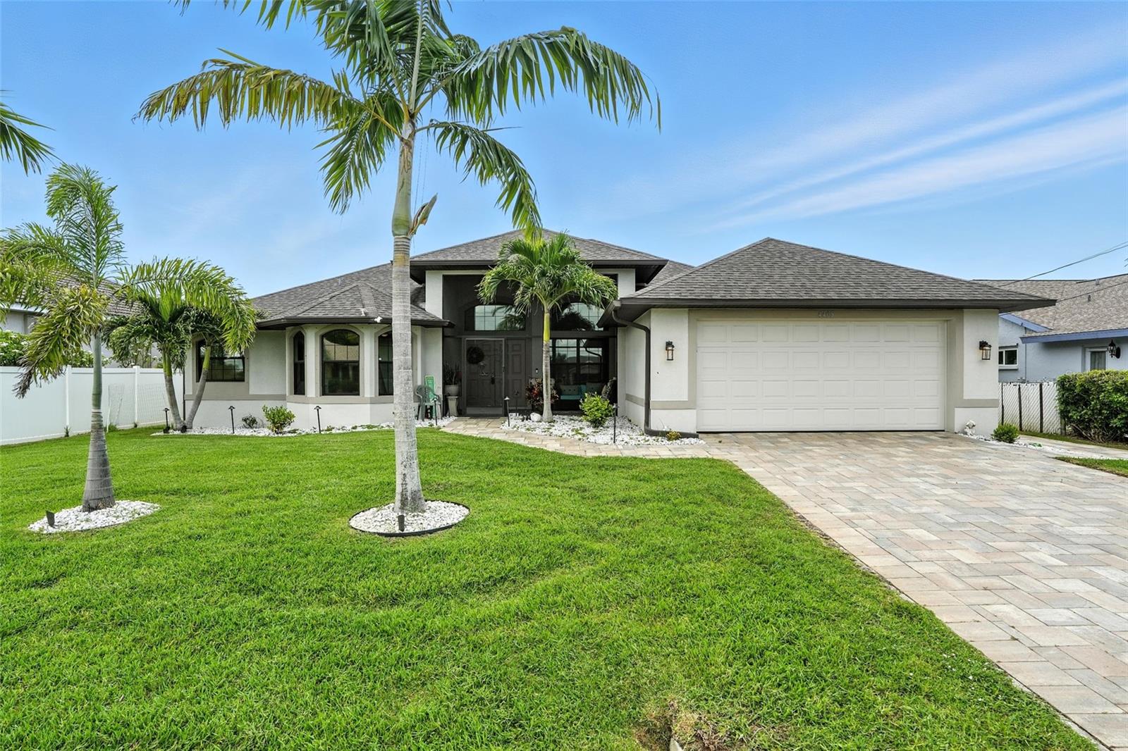 $1974 transferable flood policy!!! Gulf access + an unforgettable view in one of the most desirable areas of SW Cape Coral! This impeccably maintained 3-bedroom + den, 2.5-bath pool home is everything you’ve been searching for—whether you're a boater, entertainer, or just dreaming of the perfect Florida escape.
The open layout offers two spacious living areas with tile flooring throughout the main space, modern lighting, and a flow that feels both elegant and relaxed. The kitchen is a showstopper, with crisp cabinetry, quartz countertops, stainless steel appliances, and a gorgeous tile backsplash—ideal for hosting or just enjoying your morning routine in style.
The master suite is its own retreat, offering privacy and comfort with a large walk-in closet, dual sinks, a soaking tub, and a newly tiled walk-in shower. And here’s the best part—you can wake up and enjoy the water view right from your bed. Talk about a dream start to your day!
Now for the wow factor—step outside and you’ll understand why its so beautiful here on the water in Cape Coral. Imagine welcoming guests as they walk through the door and immediately pause to take in the stunning water view. Out back, you’ll find your own private paradise: a screened-in lanai, sparkling pool, and a dock that’s simply next-level—built with composite decking and a 10,000 lb boat lift, perfect for launching your next adventure. Sip your coffee dockside while watching dolphins play in the canal or enjoy golden-hour sunsets with a glass of wine in hand.
Other outdoor upgrades include a privacy fence and dual paver walkways. And don’t forget the oversized garage—spacious enough for two cars and even a third smaller vehicle or golf cart.
This home checks every box—condition, location, and lifestyle. Just minutes from Cape Harbour, dining, and shopping, it's truly move-in ready and waiting for its next chapter.