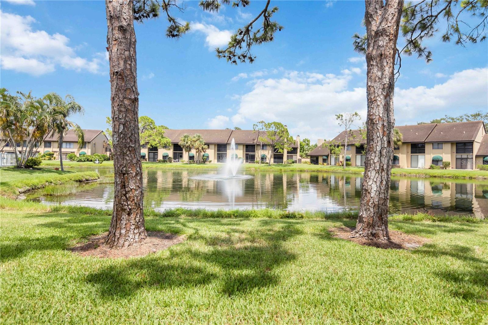 Location! Location! Location!!! Only 3.5 miles to the world-famous sugary sands of Siesta Key Beach! Experience the unique fine quartz sand from the Appalachian Mountains. A much sought after ground floor unit with a 26'x12' front porch, fully tiled floors, 2-bedroom 2 baths, unfurnished, screened lanai with lake view and a single car garage is ready to be owned by you. Unit is bright and airy. Kitchen, guest & master bathroom are tastefully updated. Relax on the lanai watching our flora & fauna. Ashton Lakes Community is located on 55 acres of luscious greenery with 4 lakes, a combination of 2 tennis & 4 pickleball courts, 2 heated pools, large pool with lap lane, shuffleboard, clubhouse, grilling stations and other amenities. Close to I-75, rte.41, shopping, restaurants, hospital and schools. Our complex is also connected to Merchants Mart by foot bridge. Shops include, CVS pharmacy, restaurants, ACE hardware, Dollar store and the famous Detwiler's Farm market. It's all there for you...come, make this slice of heaven your paradise in the sun. Please contact agent for a private tour. Roof 2020, see attachments for disclosures, updates and furnishings left behind. Welcome to Ashton Lakes....