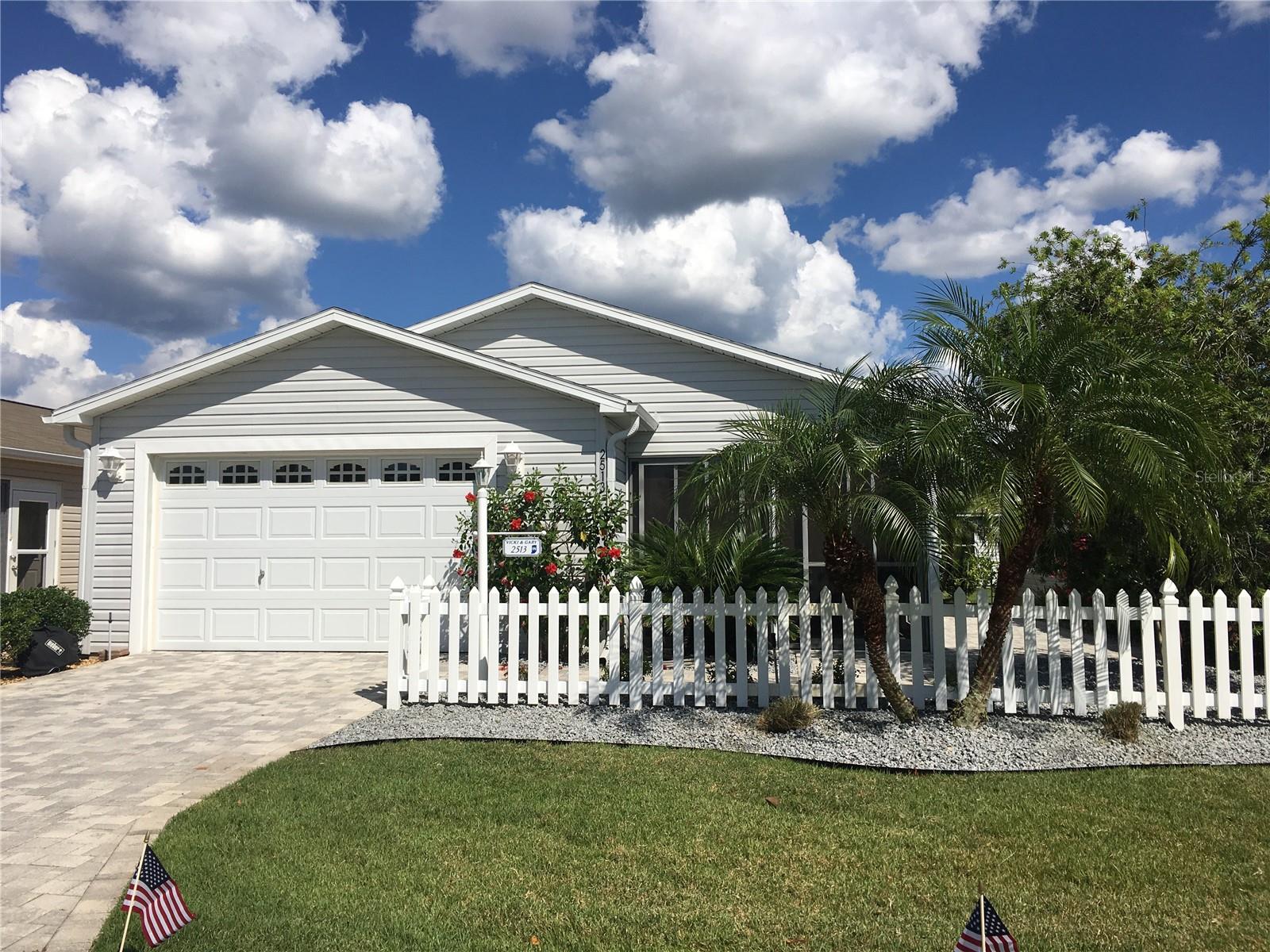 Under contract-accepting backup offers. Welcome to 2513 Everwood Ct., a beautifully maintained 2-bedroom, 2-bath Patio Villa with exceptional curb appeal and professional landscaping, located in the desirable Village of Duval. Lightly used just 4 months a year, this home is in pristine condition and ready for immediate enjoyment—sold turnkey, including a 2016 Yamaha gas golf cart!Enjoy the open, airy feel of vaulted ceilings and tasteful décor throughout. Both spacious bedrooms feature king-size beds and brand-new carpeting for comfort. The enclosed lanai and paved patio areas are ideal spaces to relax and entertain. Updates include: New ROOF and WATER HEATER 2024, HVAC 2021, New washer and Dryer. This home also includes pavers on driveway, sidewalk, patio and Lanai, a workbench in the Garage and water softener. Conveniently located just minutes from Duval Pool, multiple golf courses, shopping, and restaurants—only 10 minutes to Lake Sumter Landing and 11 minutes to Brownwood Paddock Square. With a low bond balance of just $5,307.95, this home offers unbeatable value in a prime location.
Whether you’re looking for a seasonal retreat or full-time Florida living, this move-in-ready villa delivers. Schedule your showing today!