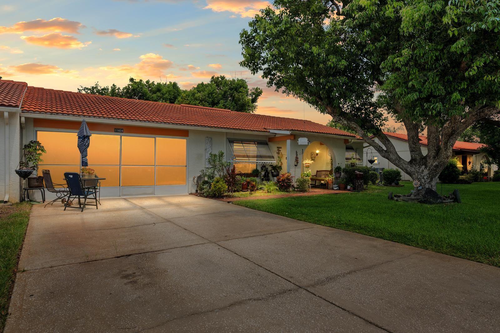 Don’t miss your chance to own this well-cared-for villa in the desirable 55+ community of Spanish Gates at Timber Oaks. Offering approximately 1,440 square feet of heated living space and 1,915 square feet under roof, this home features a split and semi-open floor plan with 2 bedrooms, 2 bathrooms, and a 2-car garage, plus a spacious extended sunroom—perfect for relaxing or entertaining.
This villa is being offered fully furnished, including an impressive collection of solid wood and high-quality pieces. The primary bedroom features a queen solid wood frame and mattress, solid wood dresser with mirror, matching armoire, two solid wood twin beds, a coordinating chest, chair, and nightstand. In the living room, you'll find a three-seat sleeper sofa, a matching double-recliner loveseat, three accent chairs, a leather-wrapped solid wood trunk, two floor lamps, a brand new 75” smart TV with matching TV stand, and more.
The dining area includes a rich solid wood table with six matching leather and wood chairs, plus a second high-top dining set with six stools—perfect for gatherings. Additional furnishings include a wood and metal pantry rack with glass-door compartments and drawers, a bar stand with wine rack, and a stunning three-piece solid wood wall unit (8’ wide x 6’ tall). Also included are two footstools, a solid oak computer desk (30”W x 42”H), a solid wood kitchen bistro table with two matching chairs, and a kitchen cart.
The kitchen comes well-equipped with pots, pans, and china. You’ll also find many decorative wall pieces, framed artwork, flower vases, and more. The garage offers a selection of tools and storage cabinets—ideal for hobbyists or those who enjoy a tidy workspace.
Residents of Timber Oaks enjoy a wide range of amenities, including a private community pool and a neighborhood pool, tennis courts, and a clubhouse with a game room, library/business center, sewing room, and event space for social gatherings. This home offers exceptional value, comfort, and lifestyle—schedule your private showing today!