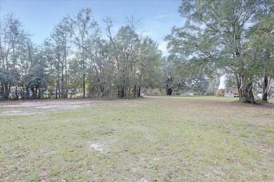One of the most beautiful lots in the area with a hugh Granddaddy Oak tree plus a driveway already installed! This parcel is just what you have been waiting for to build your new home or put a mobile home on or an RV! Located within minutes easy access to downtown Lake Butler, High Springs, Alachua or Lake City - wherever you want to go! Don't let this one get away!