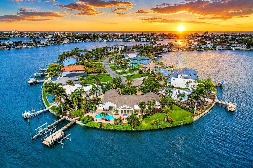 A rare waterfront retreat in the heart of Indian Rocks Beach. This extraordinary waterfront estate offers a level of privacy, serenity and coastal beauty that is rare. Set on an expansive double lot with 216 feet of water frontage, the property feels like a private resort, surrounded by lush tropical landscaping featuring mature palms that create a secluded paradise. Enjoy panoramic views, dolphins play just beyond the dock and relax beside the pool. Professional landscape lighting transforms the property into a magical waterfront oasis, creating the ideal backdrop for an evening swim, cocktails around the fire table or dining under the stars. The outdoor pool, shower and bath work well to avoid unnecessary wet entry to the main house. Boaters/anglers alike will appreciate the waterfront amenities, a large dock installed 2021, with water service, electrical hookups, a 24,000-pound and 10,000-pound boat lift. Whether heading out for a day on the water or casting a line from your backyard, this property is designed to embrace the waterfront lifestyle. Multiple outdoor gathering spaces offer something for everyone. The covered patio provides a comfortable retreat for grilling, entertaining, or watching the game, while the expansive lawn offers endless possibilities for recreation, a future putting green or additional outdoor enhancements. A tucked away section of the property presents an opportunity for a hot tub, tiki hut or additional private retreat. The fenced yard provides a space for pets. Inside, the thoughtful design accommodates everyday living and entertainment. This property is fully furnished and decorated, making it turnkey ready for instant rentals or staying the night yourself. Primary suite enjoys direct pool access and captures beautiful sunrise views. Split-bedroom floor plan offers privacy. One guest bedroom features stunning Intracoastal views, while the flexible fourth bedroom can easily serve as a home office or den. The spacious living areas comfortably accommodate large gatherings, with a generous dining room, an inviting sunroom ideal for morning coffee and a separate family room that opens directly to the covered patio. The well-appointed kitchen offers abundant cabinetry and workspace, with excellent potential for a future open-concept redesign. A large laundry room provides additional storage and flexibility for future customization. Designed for effortless indoor-outdoor living, this home has hosted everything from family reunions to weddings and offers a floor plan that seamlessly blends comfort, functionality and entertaining space. On a quiet cul-de-sac with friendly neighbors and a mix of full-time and seasonal residents, the setting is peaceful while remaining incredibly convenient. Enjoy a short golf cart ride to the beach, local restaurants, parks and the beloved Indian Rocks Beach Art Center. Seeking an investment opportunity, the property has a proven history as a successful short-term rental. Its unique combination of privacy, waterfront amenities and prime location has made it a favorite among guests, creating an exceptional experience for visitors while maintaining harmony with the surrounding neighborhood. Searching for a primary residence, vacation retreat or potential income-producing waterfront property, this remarkable coastal estate offers a lifestyle that must be experienced to be fully appreciated. It has the potential to rebuild or split into two lots.