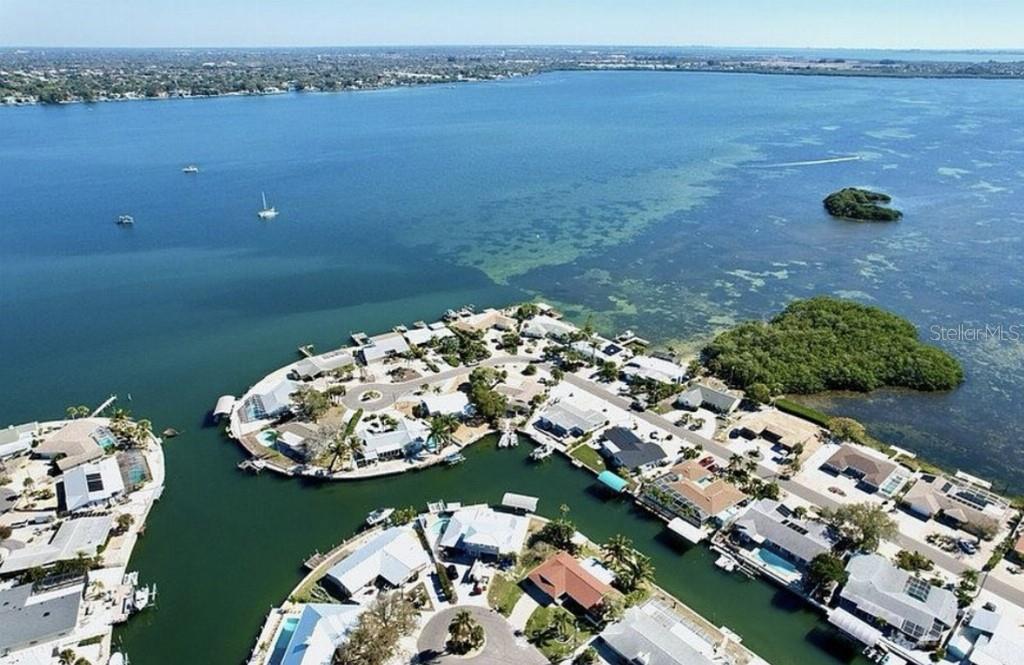 Best buy on the water, home is perfection! Priced below Zestimate. Don’t let that fool you, this house is a winner and will not disappoint…just in a situation where we need to sell! Welcome to a tropical paradise! This saltwater canal home with a newer boat lift is charming updated tastefully decorated home on a deep and wide canal just a couple homes from Palma Sola Bay. No fixed bridges to the ICW. This stunning home has all new flooring, baseboards, lighting, appliances, vanity, hurricane sliders, all new interior and exterior doors, some new windows, landscaping, and is freshly painted in neutral colors. New pavers on driveway and sidewalk, new quartz countertops throughout, new upscale marble tile in kitchen and bathrooms, new custom glass shower doors, lanai has no-seum screens, new top of the line Carrier HVAC. This lovely home is ready for you to move into and relax in the large tiki hut overlooking the water as well as additional decking for sunbathing. Enjoy FL waterfront living at its best in a friendly community. This home is perfect for a family or second home. Within 3 miles of Anna Maria Island and the beaches yet tucked in a peaceful neighborhood away from crowds, this is as good as it gets! Take the trolley, bicycle, boat or drive to waterfront restaurants, shops, and beaches or enjoy a relaxing float through Robinson Preserve. If you are or want to be a serious boater, this home will not disappoint! Voluntary HOA.