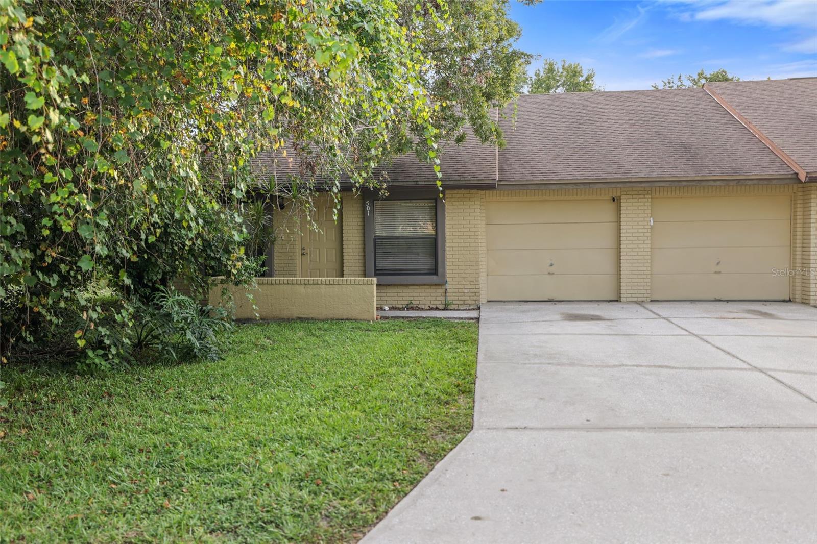 This 3-bedroom, 2-bath villa with a 1-car garage offers comfort, style, and convenience in the sought-after North Village community. Featuring wood-look tile throughout, the home boasts an open-concept layout with soaring ceilings that create a bright and spacious atmosphere. The kitchen, complete with stainless steel appliances and breakfast counter, flows seamlessly into the dinette and expansive living room. Glass sliding doors lead to a screened-in lanai, the perfect spot for morning coffee or evening relaxation while enjoying the tranquil surroundings. The primary suite features a generous layout and a private en-suite bath, while the additional bedrooms provide flexibility for family, guests, or a home office. Community amenities include a centrally located pool, and the villa is just minutes from the Pinellas Trail, historic Sponge Docks, downtown Tarpon Springs, shopping, dining, parks, and world-famous beaches.