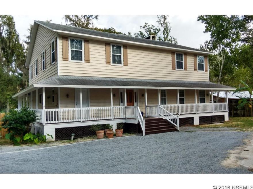 You won't just be pleased, you'll be WOWED!!.  Invest in the original Florida waterfront with it's magnificent wildlife and relaxing views of the Wekiva River.  European craftsmanship built this home which is evidence by the look and feel once inside the home.  Twenty-four foot ceilings in the living/dining room with floor to ceiling fieldstone wood burning fireplace!  4-5 bedroom main house with  separate 2 bedroom quest quarter or in-law suite. The kitchen was recently update with granite countertops and stainless steel appliances while still retaining the Florida farmhouse period charm.  Imagine being able to get away to your quiet place yet be only minutes from Orlando and all of the attractions.  This home boast an Open Floor plan, Large living spaces, front porch waiting your rocking chair, large screened in back porch overlooking a lushly landscaped lawn and plenty of water activities  all making this a unique place you will want to share with family and friends.