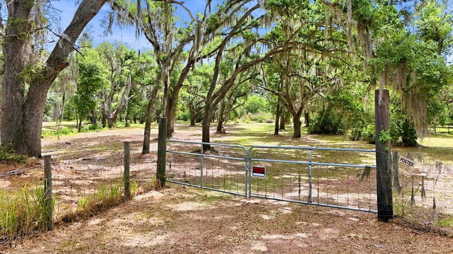 Discover the ideal blend of privacy, natural beauty and convenience with this fenced 5-plus-acre property in Myakka City, in Manatee County just outside Lakewood Ranch. This unique parcel features a pond and a creek, creating a peaceful setting surrounded by native woodlands that provide shade and natural privacy. The property has been professionally cleared of dead trees and mulched, while preserving the character and beauty of the land. Zoned Agricultural with no HOA or deed restrictions, this property offers incredible flexibility for a variety of uses. Whether you're dreaming of building a private estate, starting a farm, bringing horses or creating your rural retreat, the possibilities are endless. Enjoy country living while remaining just minutes from Lakewood Ranch’s shopping, dining, golf courses and everyday conveniences, with easy access to nearby beaches and Interstate 75. Information deemed reliable but buyer and buyer's agent to verify. Survey and environmental review available upon request. Private, secluded and ready for your vision, this is a must-see property to fully appreciate all it has to offer.