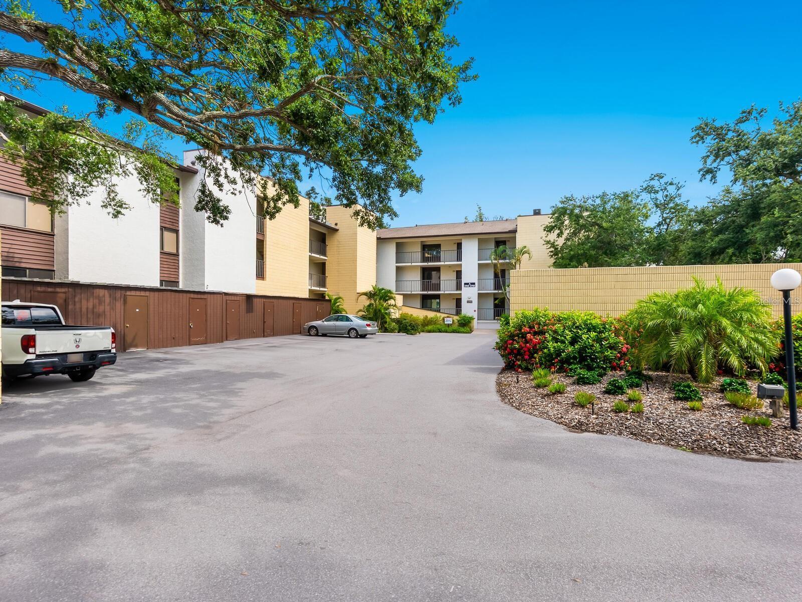 UNFURNISHED ANNUAL RENTAL. This beautifully updated two-bedroom, two-bath condominium offers comfort, style and convenience in a lush, park-like setting. Enter to new carpet and freshly painted interiors, complemented by high-end finishes including solid wood cabinets, crown molding and a custom built-in bar ideal for entertaining. Enjoy peace of mind with hurricane-impact windows installed in 2023, The guest bath has been fully remodeled with elegant Restoration Hardware finishes, and a new washer and dryer (2023) add everyday convenience. Take in serene views of the pool and Philippi Creek from the spacious living room and both bedrooms or relax on the large screened lanai surrounded by mature landscaping. This condominium is in a vibrant pet-friendly community featuring a five-acre park along Philippi Creek, a clubhouse with active social calendar, and a pedestrian bridge to Tuttle Bee Plaza for easy shopping and dining. Just minutes from white sands of Siesta Key (under five miles) and the arts and culture of downtown Sarasota (less than four miles), this centrally located oasis is a rare find. Rent includes water/sewer and pest control. CARPORT WILL BE INSTALLED IN THE NEAR FUTURE.