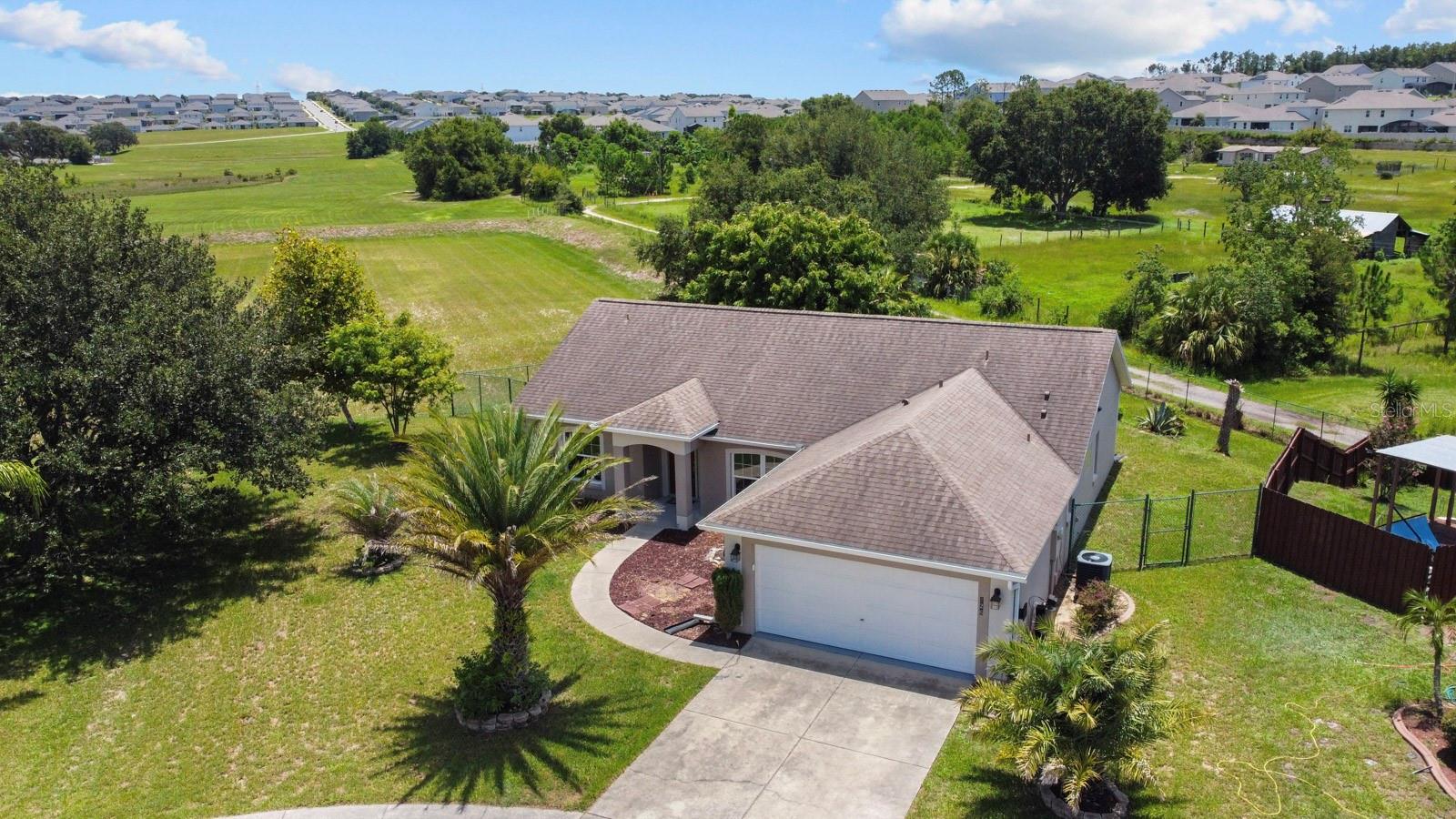 This cute home is tucked in the back of Minneola's Quail Valley community with No Rear Neighbors! (Minneola and Clermont are neighbors for proximity!) Let's cut to the chase.... Why live in an apartment when you can have an entire 3 bedroom, 2 bath home for the SAME price!?! This home has been privately owned for years and is now being offered for a long term lease. Home is partially furnished with a large leather sectional in the great room, and entertainment center. The eat in kitchen has white cabinets with newer stainless appliances. The entry has a flex space for a desk or formal area. A large screen porch spans the back of the home with acrylic windows. Enjoy the beautiful sunsets and breeze from this elevated homesite! Home also has a laundry room and 2 car garage. Convenient to the turnpike, local schools, shopping and everyday conveniences!!! Just 5 minutes from Historic Downtown Clermont and public boat ramp to the North and South Chain of Lakes! Looking for someone to LOVE her home as much as she has!