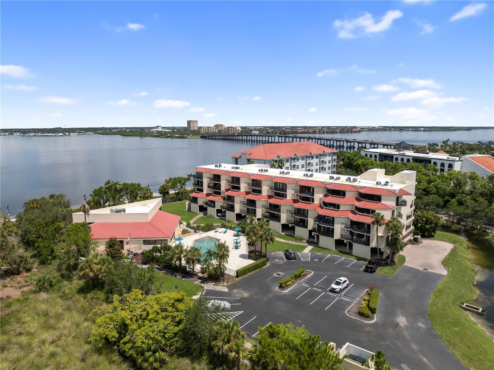 Welcome to River Yacht and Racquet Club, an exceptional residence that defines luxury living in the heart of downtown Bradenton. This exquisite 2 bedroom, 2 bathroom condominium has been completely reimagined and remodeled from the baseboards to the ceilings, creating a flawless blend of modern sophistication and timeless elegance. Every detail has been thoughtfully curated, beginning with a redesigned kitchen that boasts a reconfigured floor plan, custom cabinetry, under cabinet lighting, a striking lighted feature wall and column, and a one of a kind custom sink system with integrated cutting boards, trays, and strainer. Throughout the home, nothing has been overlooked—every light fixture is brand new with dimmer capability, electric blinds enhance privacy and convenience, all faucets and showerheads have been upgraded to Moen, and new ceiling fans provide both comfort and style. Both bedrooms are elevated with state of the art electric adjustable beds featuring illuminated headboards, offering the ultimate in comfort and design. The bathrooms have been luxuriously updated while preserving the original Jacuzzi tub in pristine condition, providing a spa like retreat within the home. From the custom moldings and baseboards to the newly finished ceilings, the entire residence feels like new construction, yet within one of the most established and desirable communities in Bradenton. Expansive windows invite natural light while offering serene views of the resort style pool and a gentle bay view, creating a setting that is as relaxing as it is refined. River Yacht and Racquet Club is a gated community offering resort style amenities including a sparkling waterfront pool, fitness center, tennis and pickleball courts, a clubhouse, and private marina access, making it ideal for both active and leisure lifestyles. Just steps away, you’ll find the riverwalk, marinas, fine dining, boutique shopping, cultural attractions, and vibrant entertainment, all while enjoying the peace and exclusivity of this coveted address. This rare offering combines a prime downtown location, world class community amenities, and a completely transformed interior, delivering a turnkey luxury lifestyle for the most discerning buyer.