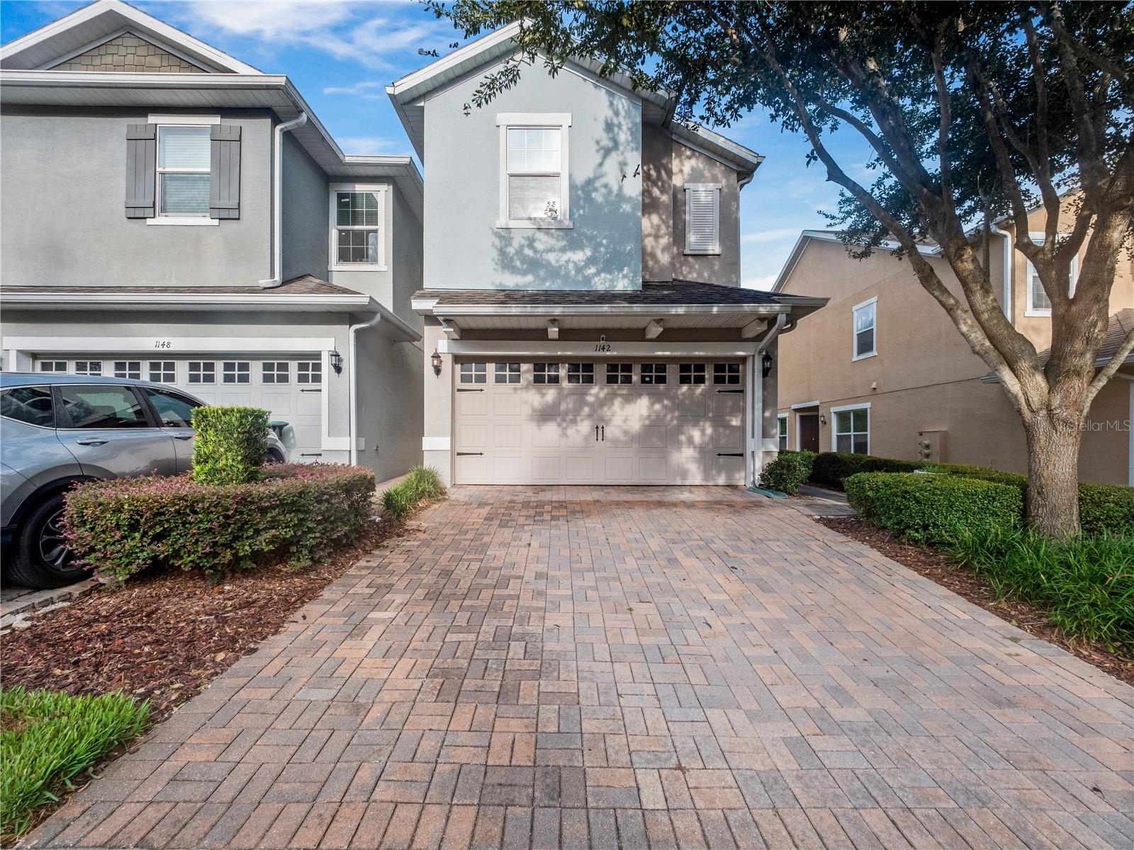 **Absolutely Stunning End Unit in Ambergate** Prepare to be impressed by this 3-bedroom, 2.5-bathroom END UNIT townhome in the highly sought-after Ambergate community. From the moment you step inside, you’ll be greeted with beautiful tile floors gracefully flowing throughout the entire first level and fresh, modern interior paint that makes the home feel brand new. The chef-inspired kitchen is the true heart of this home, showcasing 42" real wood cabinetry, gleaming granite countertops, stainless steel appliances, and a massive island perfect for meal prep, gatherings, and entertaining. For added convenience, the seller even installed an electric shade on the sliding glass door leading out to the patio. A stylish half bath is tucked downstairs as well. Upstairs, you’ll love the NEWER luxury vinyl plank flooring throughout, NO CARPET anywhere! A spacious loft awaits at the top of the stairs, ideal as a home office, second living area, or play space, the possibilities are endless! The primary suite is a true retreat with a tray ceiling, abundant natural light, and GIGANTIC WALK-IN CLOSET fit for royalty. The ensuite bath features dual sinks and an oversized walk-in shower that feels like a spa. Two generously sized guest bedrooms with ceiling fans, plus an upstairs laundry room (washer and dryer included!) complete the second floor. Step outside to your own slice of Florida paradise with a paver patio perfect for grilling, relaxing, or entertaining. Ambergate offers low HOA dues and a community playground, making it a wonderful place to call home. Centrally located just minutes from shopping, dining, and major highways including SR-441, SR-436, and SR-429, this home truly checks all the boxes. Move-in ready, full of upgrades, and waiting for you, don’t miss your chance to own this gem! Come see this majestic home before it is too late!
