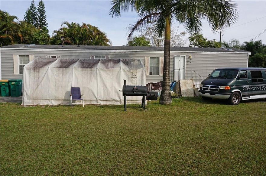 A very unique and versatile property - a private oasis in a country setting yet minutes from historic downtown Punta Gorda. Lots 41,42,43 total ONE HALF ACRE. (1206,1210 and 1214 Hickory Ave) There is a 60 x 14 Mobile Home (1974), Duplex with screened porch, large metal storage building (210 sq ft) and canvas storage. The metal storage is 20x10 and the canvas storage is 20x12. City water and 2 septic tanks. Mature landscaping as well as numerous royal palms and fruit trees added by the owner. There is a raised garden with pump for drip watering system. There is a small shed with hook up for washer and dryer. The mobile home features a living room, large kitchen with dining space, inside laundry, 2 bedrooms, 2 bathrooms, central A/C. There is currently a tenant in the mobile home. There is a separate duplex on the property with 300 sq ft on each side per owner and large 24x20 screened porch.Each side has a studio with bedroom space, kitchen, full bathroom with shower. Wall A/C. Currently there is a tenant on one side of the duplex and the owner uses the other side for an office/man cave. Both could be used rental income if preferred. There is plenty of space to store vehicles, another source of income. This property is minutes from downtown shopping, dining, medical care, waterfront parks, fishing piers, boat ramps, art galleries, events, farmers market and more! A very unique opportunity!