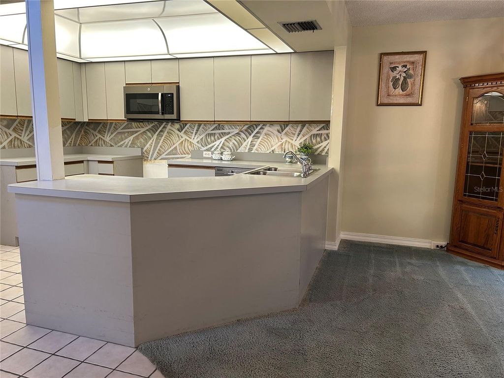 Photo of 102 Coventry Lane, Haines City, FL 33844 (MLS # O6366268)