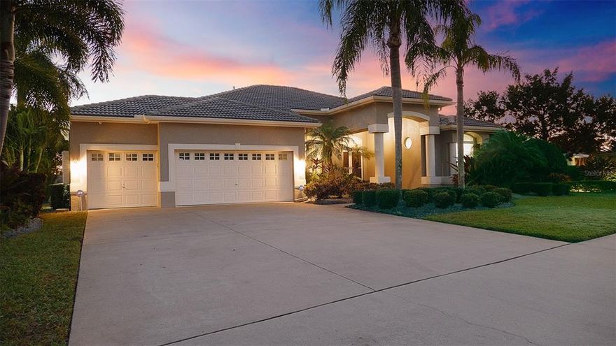 This stunning Island Estates home is a perfect blend of contemporary sophistication and absolute luxury.  The kitchen is a delight with leathered granite and custom cabinets. The Wolf convection ovens and induction cooktop will please the chefs.  In the morning you are greeted by a built-in Wolf espresso maker.  The refrigerator, freezer, along with two refrigerator drawers on the kitchen island have been custom covered to match the cabinetry & are all SUB ZERO!  The stylish lighting and fixtures that have been selected to perfectly punctuate each space will be admired by those with sharp eyes (art award winners!). The master suite has two custom closets and is beautifully decorated; featuring Kate Spade candelabras. The serene and calming, spa-like master bath has two vanities, a large frameless shower, a water closet, and an exquisite soaking tub. You'll have room for everyone in this home with four bedrooms and three bathrooms; The open layout makes it possible to live comfortably and casually. You can spend cozy evenings by the Mezzo fireplace or warm afternoons lounging by the pool in the expansive outdoor living areas that also include a cozy outdoor fireplace area as well. The light and bright interior area opens up to an enormous outside to include the saltwater pool featuring a sunscreen shelf in the shallow end, a wet bar and a beautiful waterfall spa. To top off the fun, the waterfront outdoor kitchen is ideal for large gatherings, football parties or family dinners. This home has Intracoastal easy access to the gulf and the deep water. For the boater in you, there is a slip with a custom covered 20,000-pound lift and a second 10,000 lb V-shaped lift perfect for dropping down the jet skis to float out and go!  This huge composite dock and slip (one of the largest on the island) can also accommodate a 55 ft yacht. Enjoy having this dream home that is the pinnacle of luxury, quality features and lifestyle all year. No need for flood insurance here.