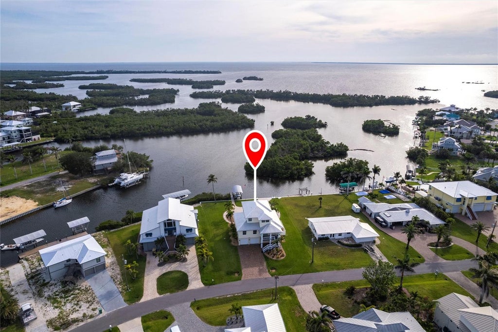 Photo of 24197 Treasure Island Boulevard, Punta Gorda, FL 33955 (MLS # TB8558039)
