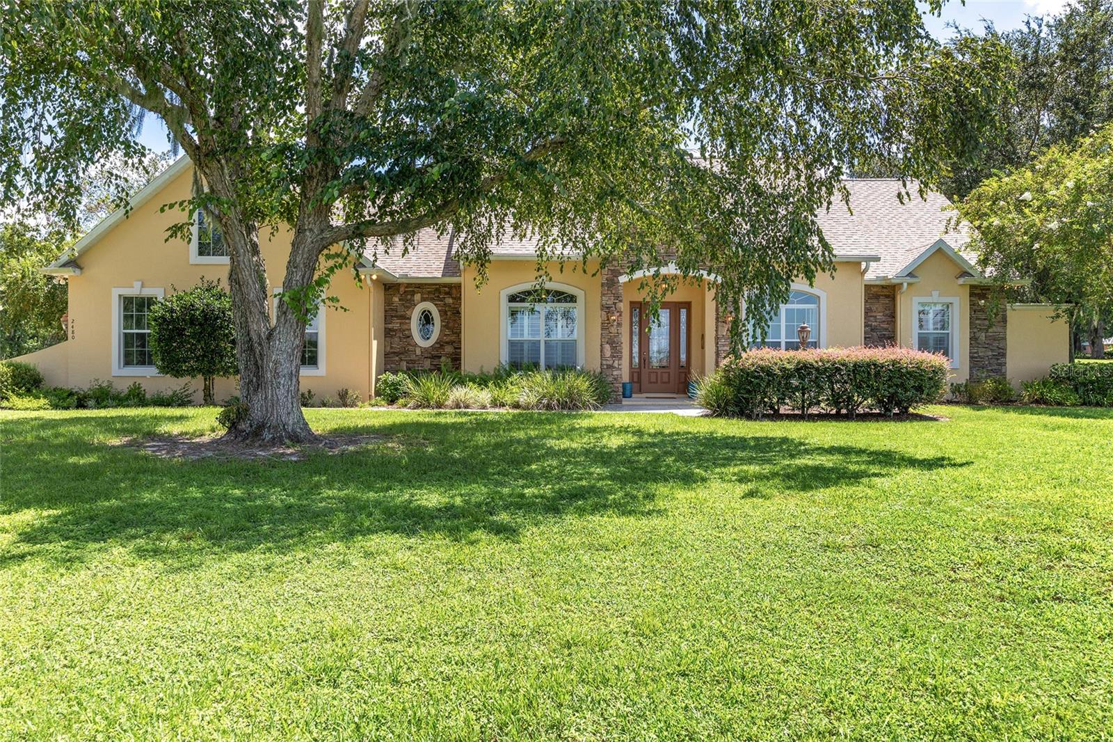 Luxury & Location – Location – Location! Private Gated Community surrounded by multi-million dollar horse farms, 2 miles from The Florida Horse Park & surrounded by the Florida Greenway! Just a stone’s throw to many Florida Greenway accesses, Historic Santos Park, SW 49th Trailhead & Land Bridge Trailhead. This beauty sits high on the hill. The curb appeal is just the beginning. Beautifully maintained from door to door & ceiling to floor. New Roof 2023, New HVAC units 2022, New Hot Water Heater 2023, Solar Heating for pool replaced 2023, new pool pump 2020…and so much more! The architectural details of this home are amazing and pleasing to the eye. The floor plan and flow of the home was well thought through during the design phase! Elegant high-coffered ceiling detail, plantation shutters and lighted display coves add a touch of class. The gourmet kitchen has ample cabinets with beautiful granite counters, double ovens and a center island with electric…and a large walk-in pantry. The family room has triple slide patio doors & overlooks the saltwater pool. There are spectacular views of the pool from the formal living room & the spacious owners suite as well. The owner’s suite features high ceilings, plantation shutters, huge walk-in closet & a luxury bath with walk in shower with rainwater shower head. The Jacuzzi bath with privacy wall enclosure is a huge bonus. The owner’s bath even has its own tankless water heater, so you never run out of hot water! The laundry room has extra storage & space for a freezer. The 3-car garage is extra wide and long so it can fit your vehicles and toys! There are two fenced paddocks and one stall barn or storage area complete with electric.